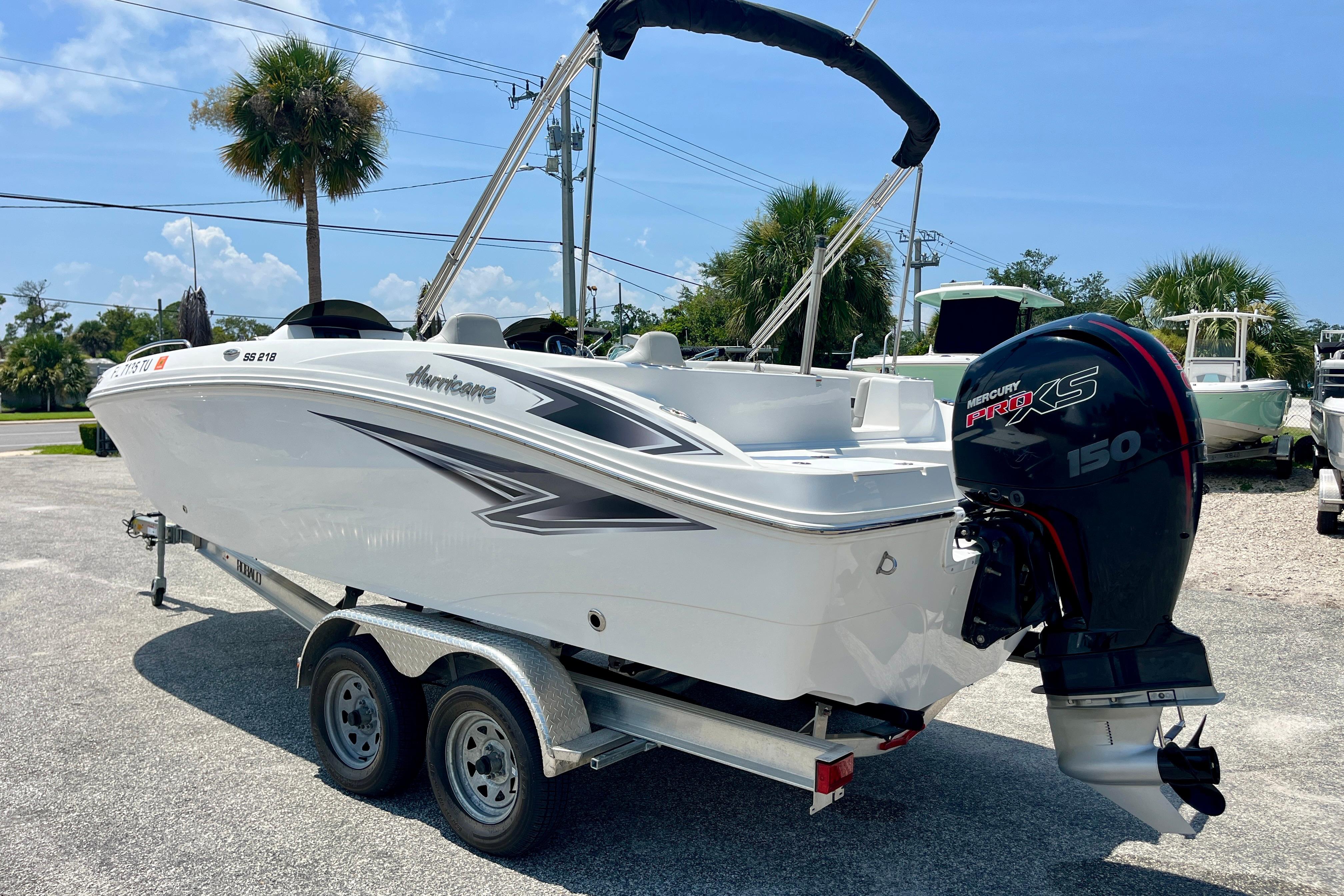 2024 Hurricane Sundeck Sport 218 OB boat on trailer with Mercury Pro XS engine.