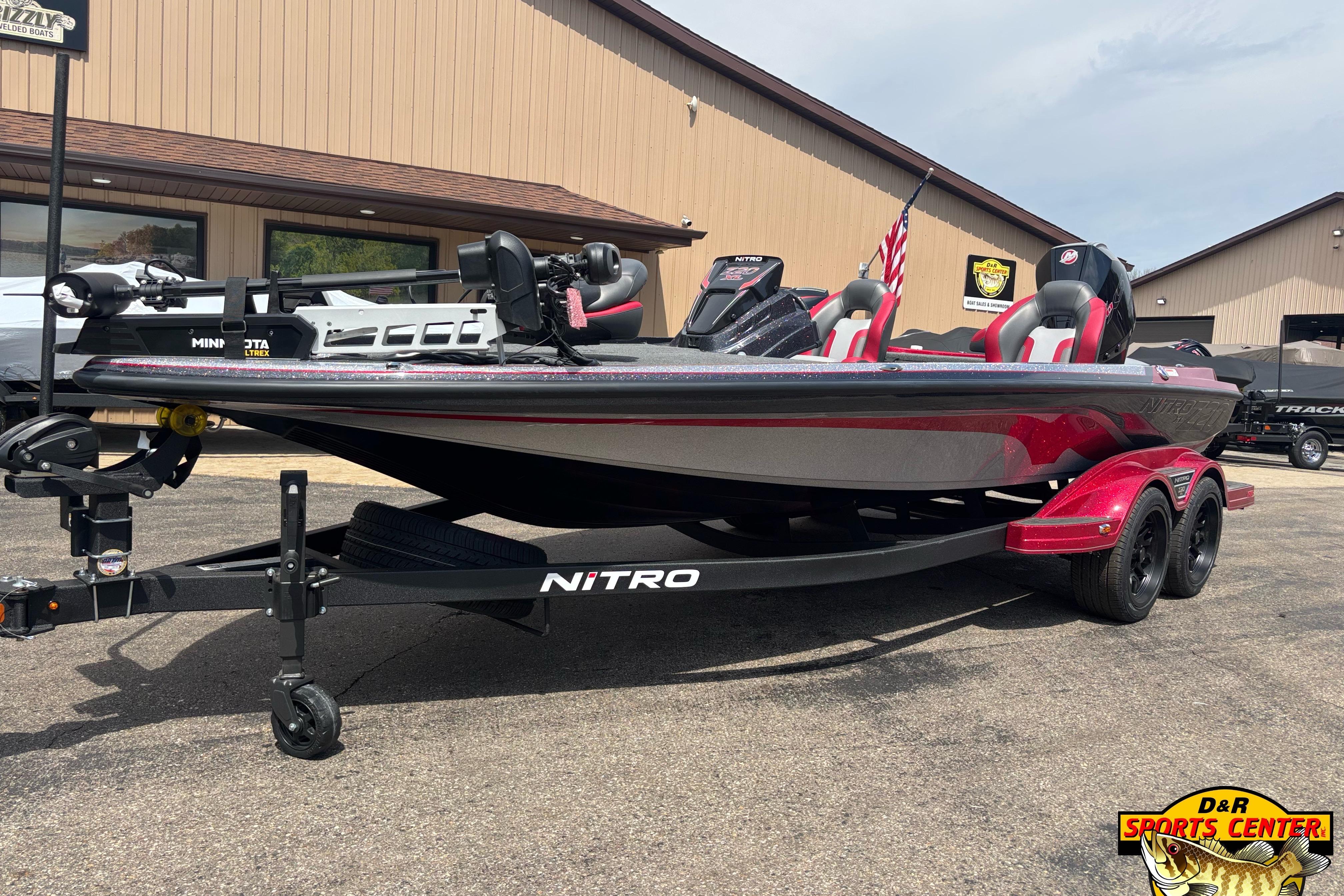2026 Nitro Z20 XL Pro boat on trailer at dealership, featuring sleek design and modern equipment.