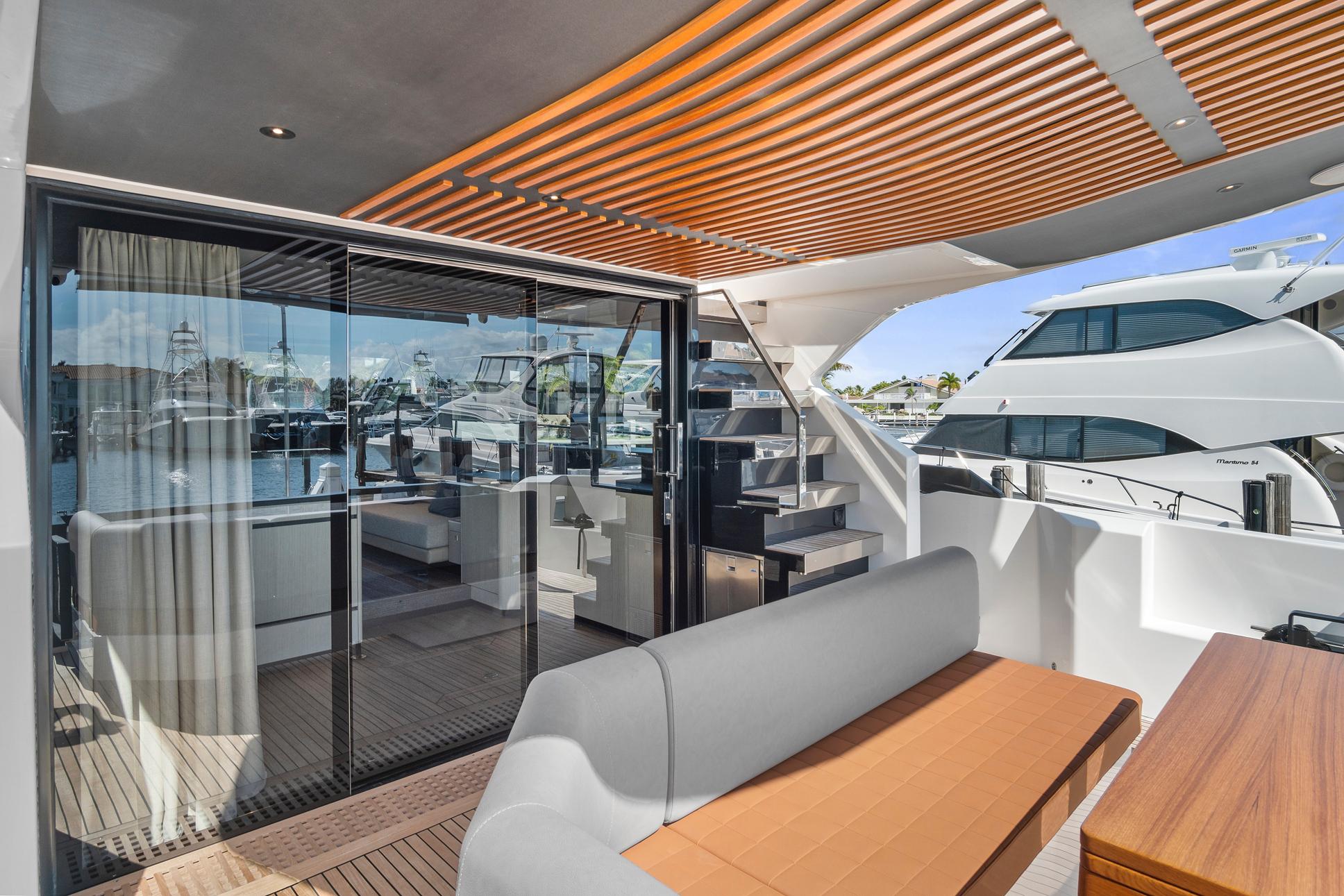Luxurious 2023 Astondoa AS5 yacht interior with modern design and spacious seating area.
