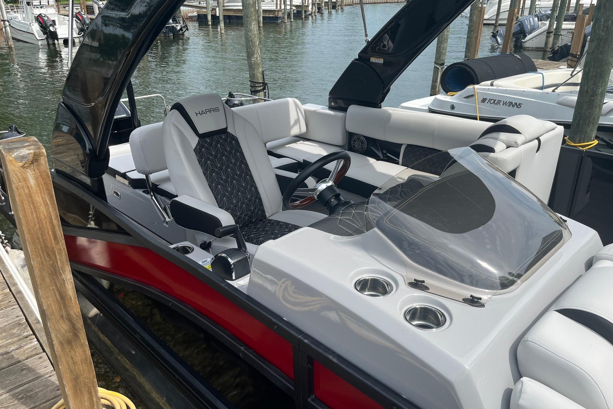 2024 Harris Grand Mariner 250 boat interior with sleek seating and modern dashboard.