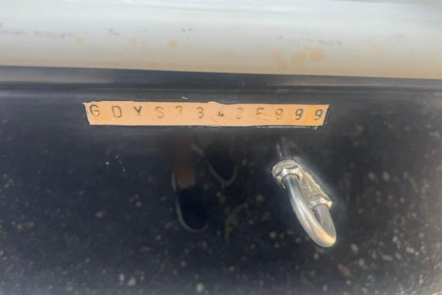1999 Hurricane SunDeck Sport 201 OB boat hull identification number with metal ring attachment.