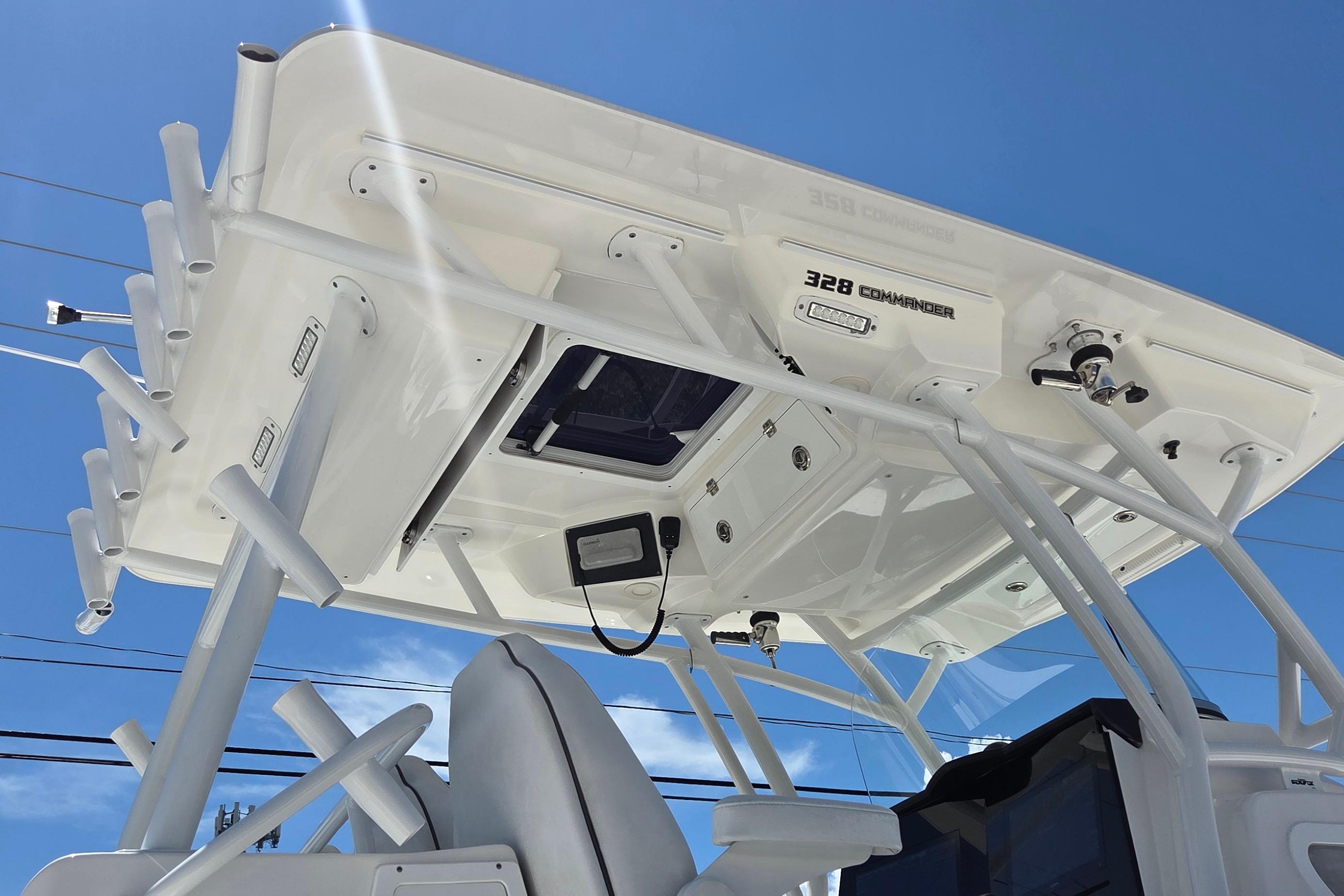 2021 Sea Fox 328 Commander boat with T-top under clear blue sky.