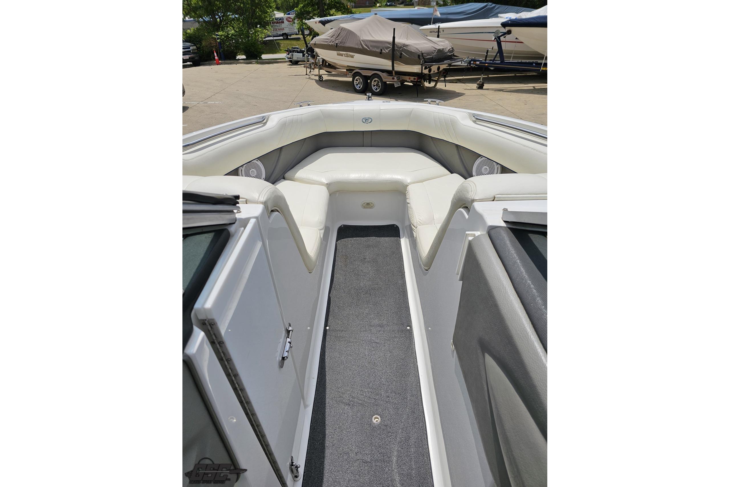 2010 Cobalt 232 WSS boat interior with cushioned seating and carpeted floor.