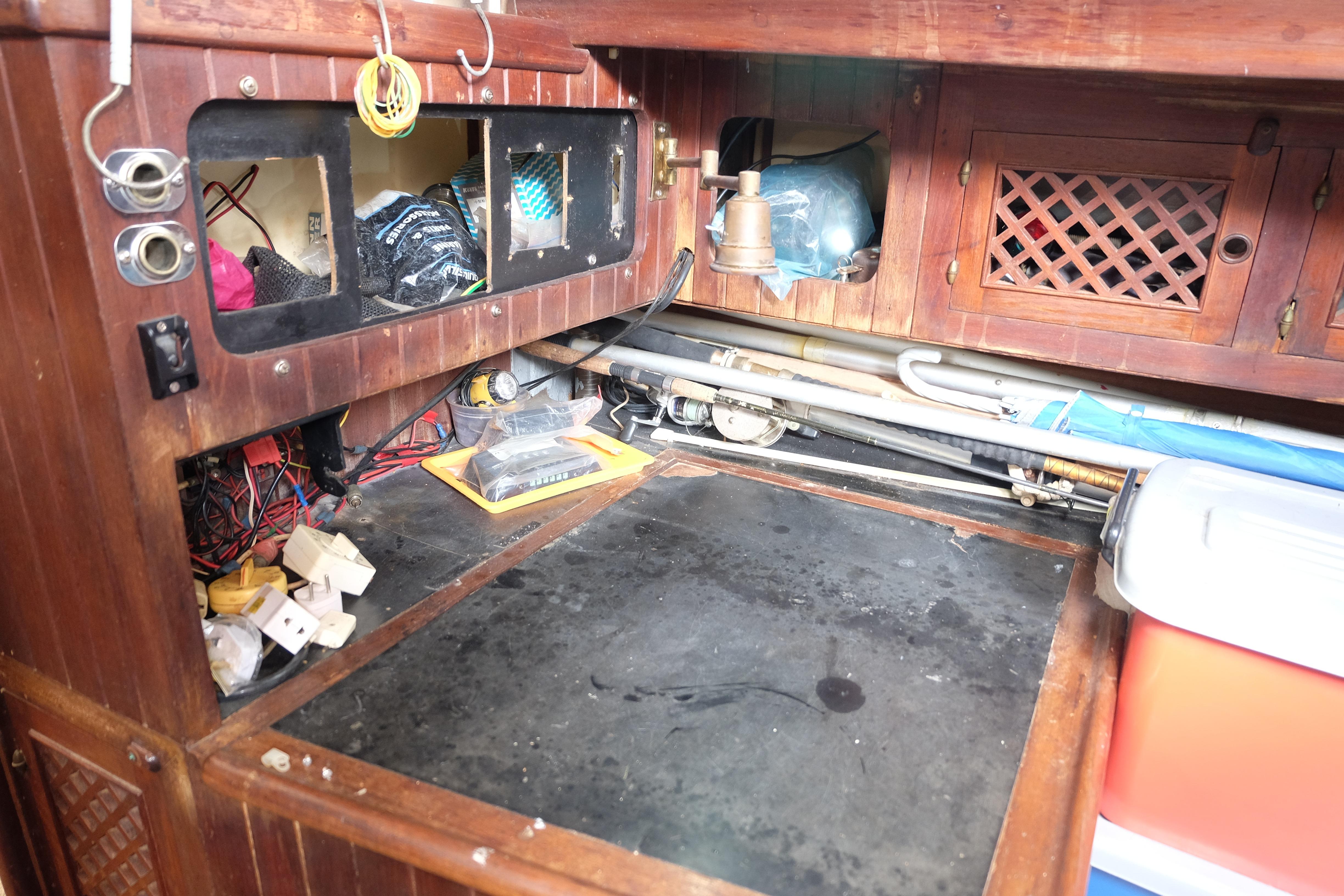 Interior of a 1979 Westwind 35 boat showing wooden cabinetry and storage compartments.
