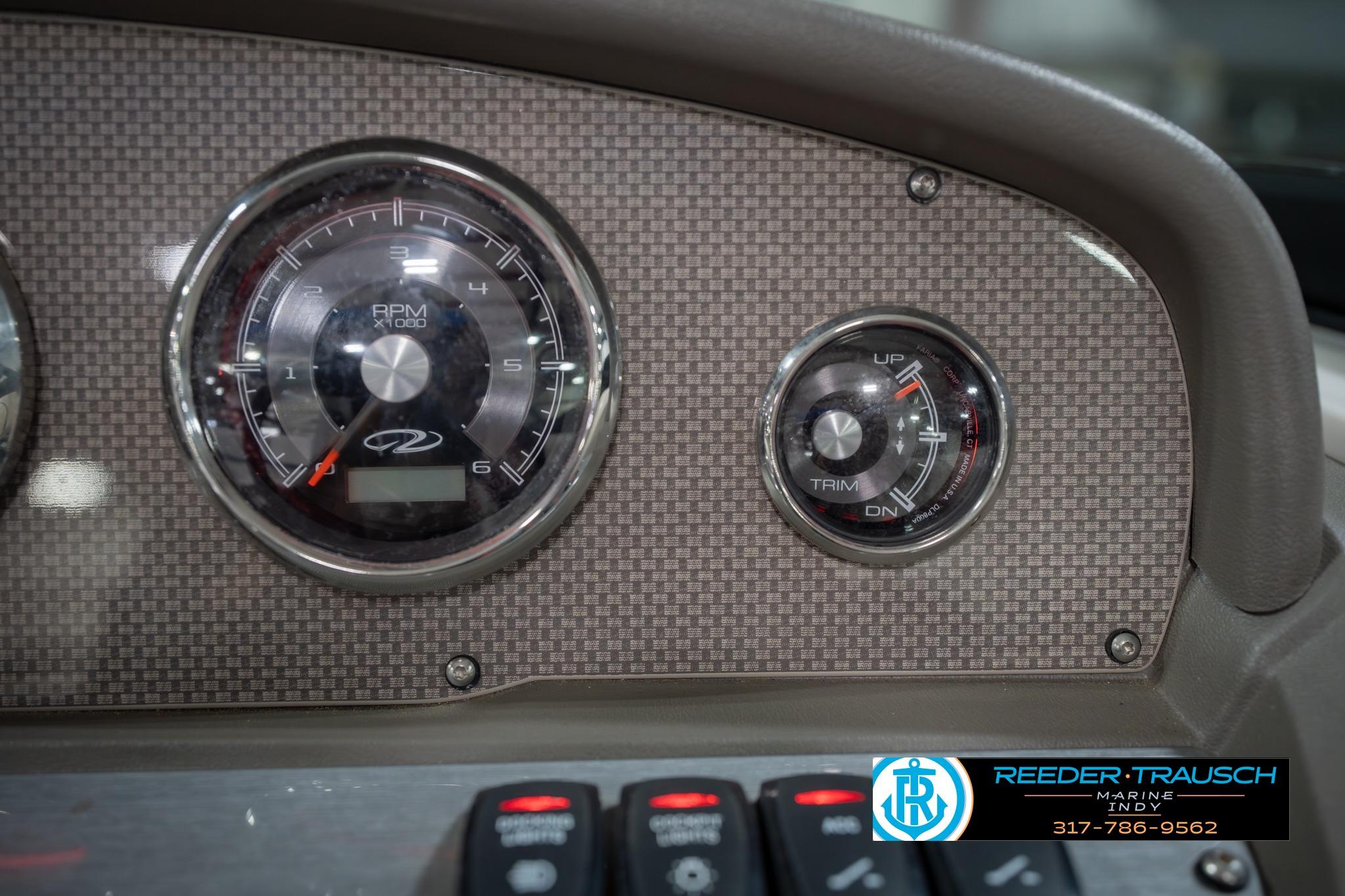 Dashboard of 2015 Regal 2000 ESX Bowrider with RPM and trim gauges.
