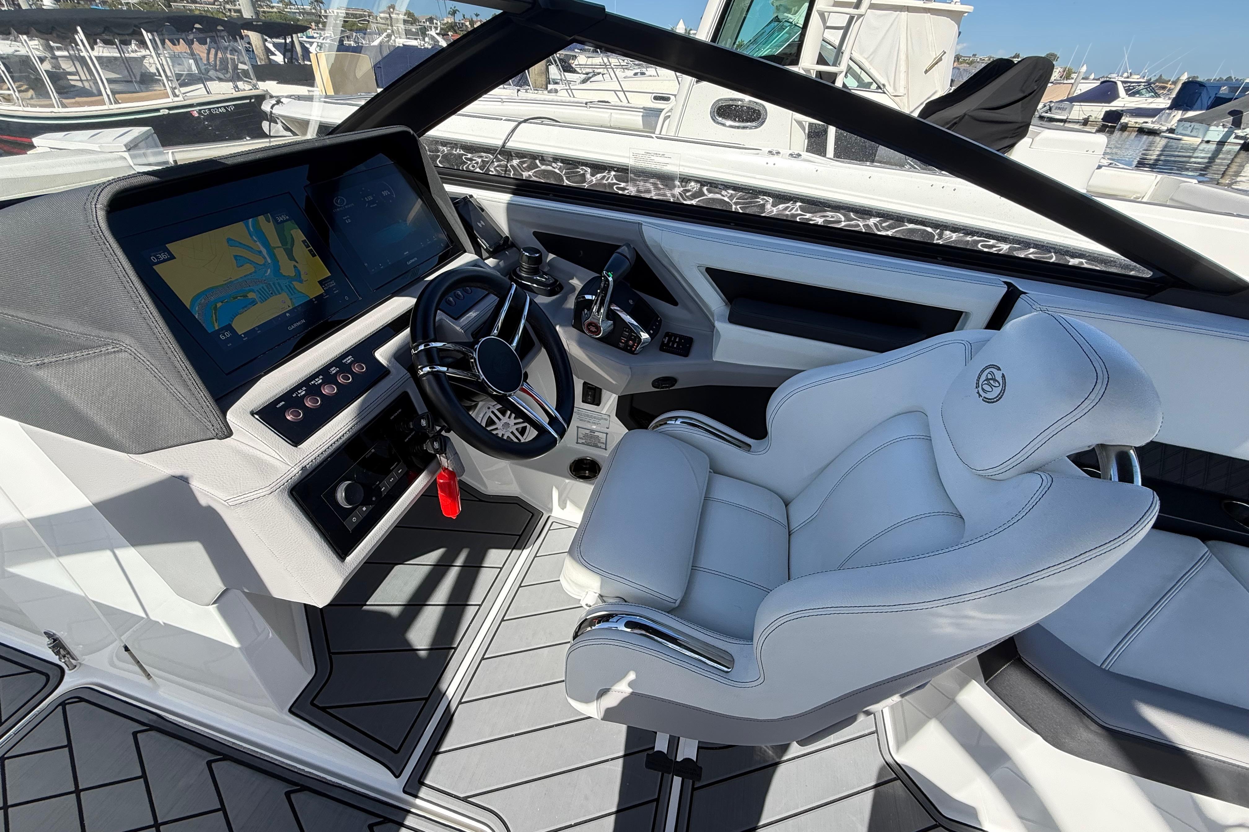 2024 Cobalt R8 Outboard cockpit with modern steering and navigation system.