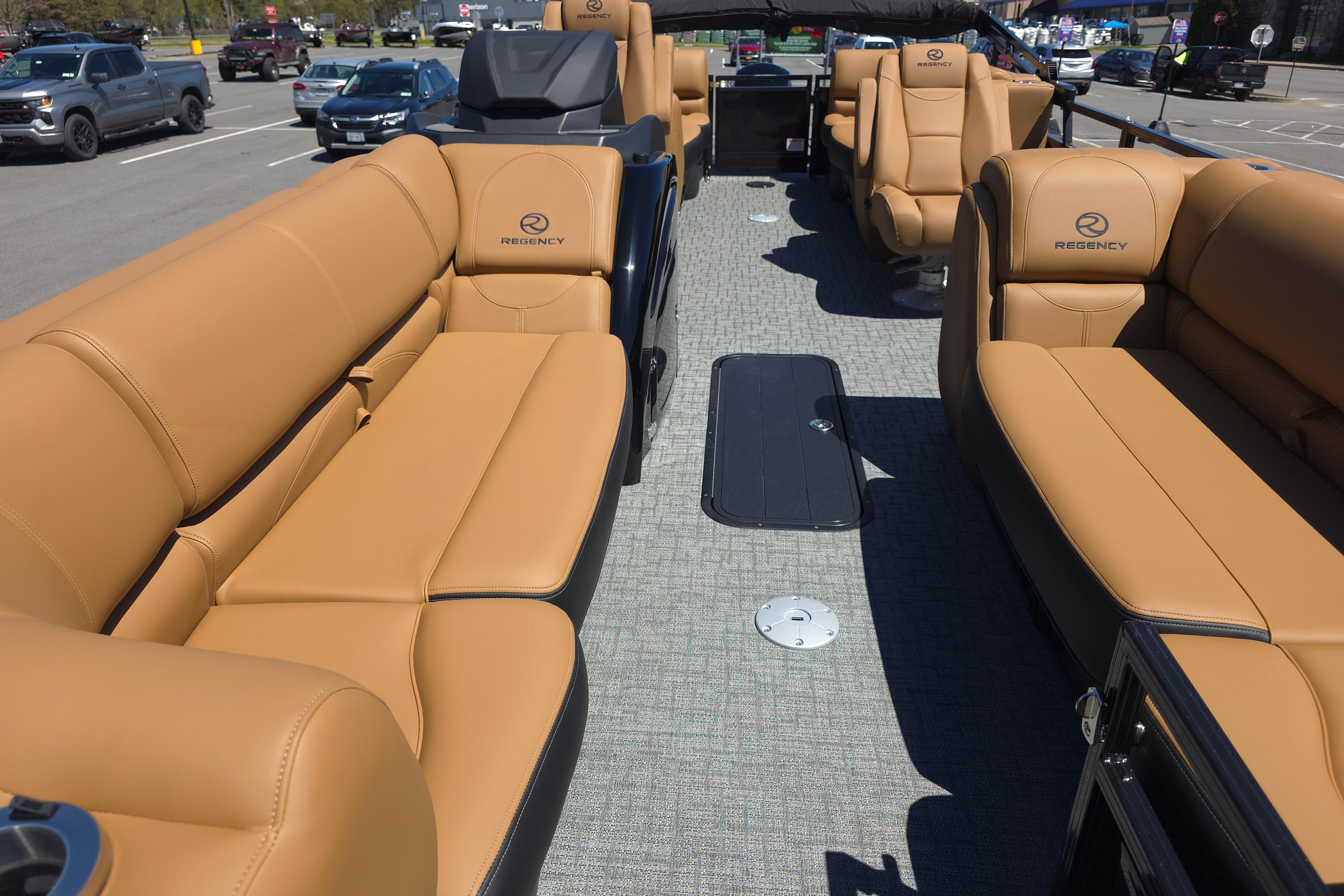 2026 Regency 230 DL boat interior with tan leather seating and modern design.