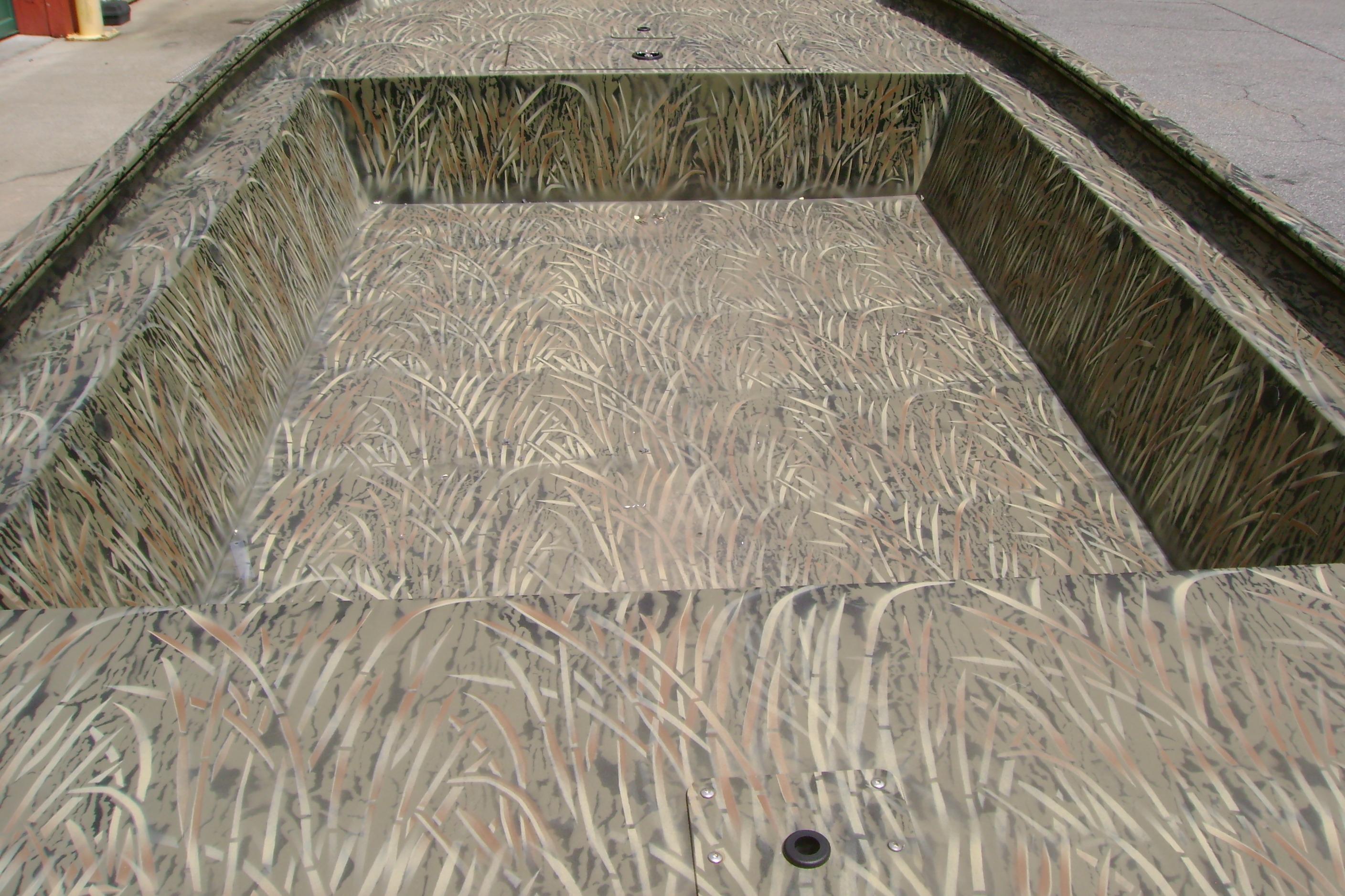 2026 Tracker Grizzly 1754 Utility boat with camouflage interior design.