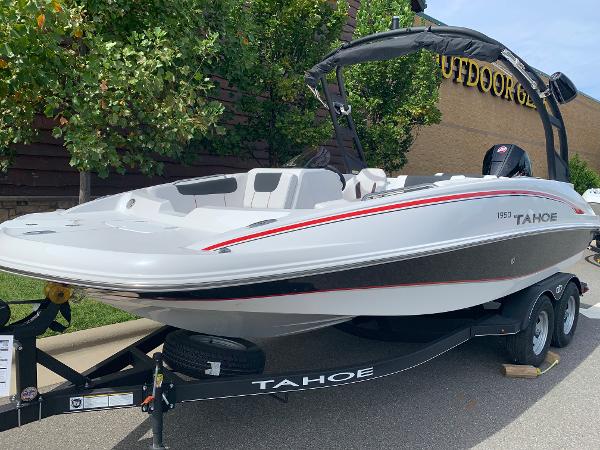 2024 Tahoe 1950 boat on trailer, displayed outdoors.
