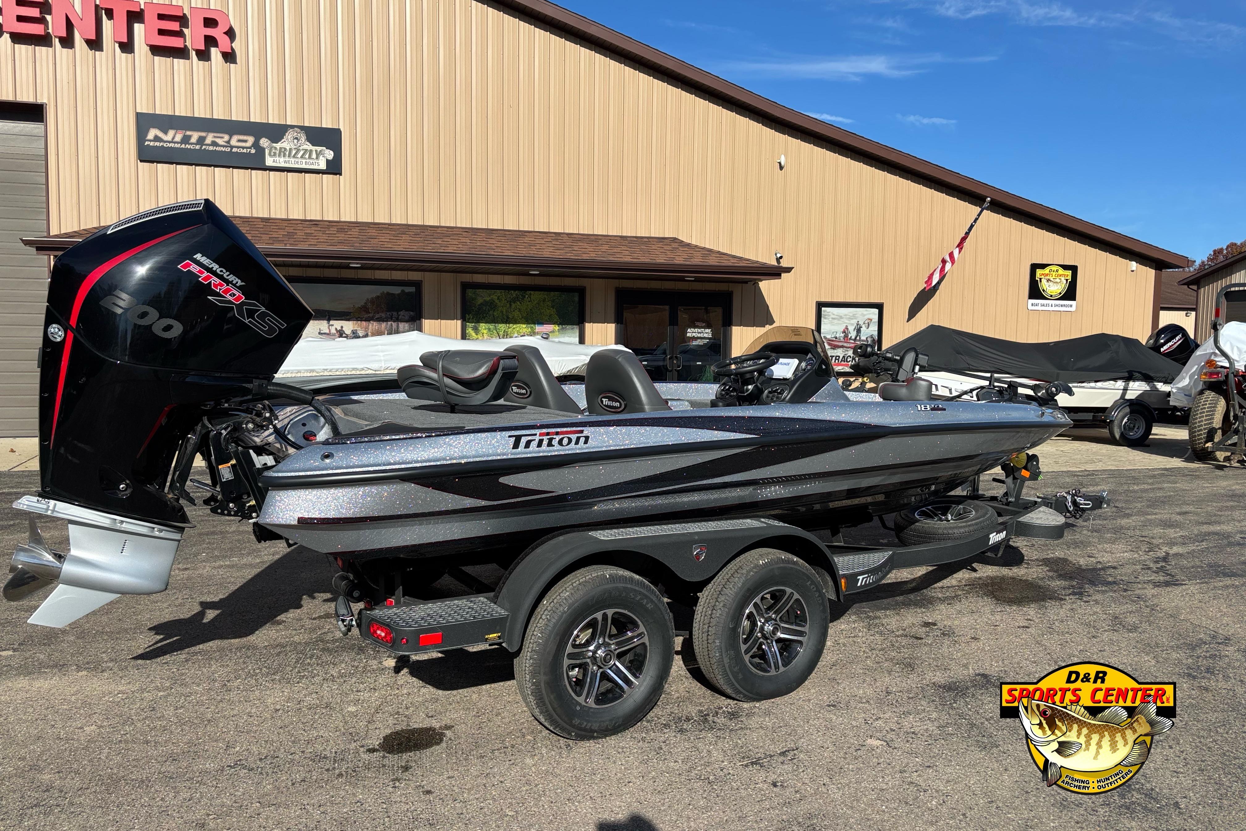 2025 Triton 18 TrX boat with Mercury Pro XS engine at dealership.