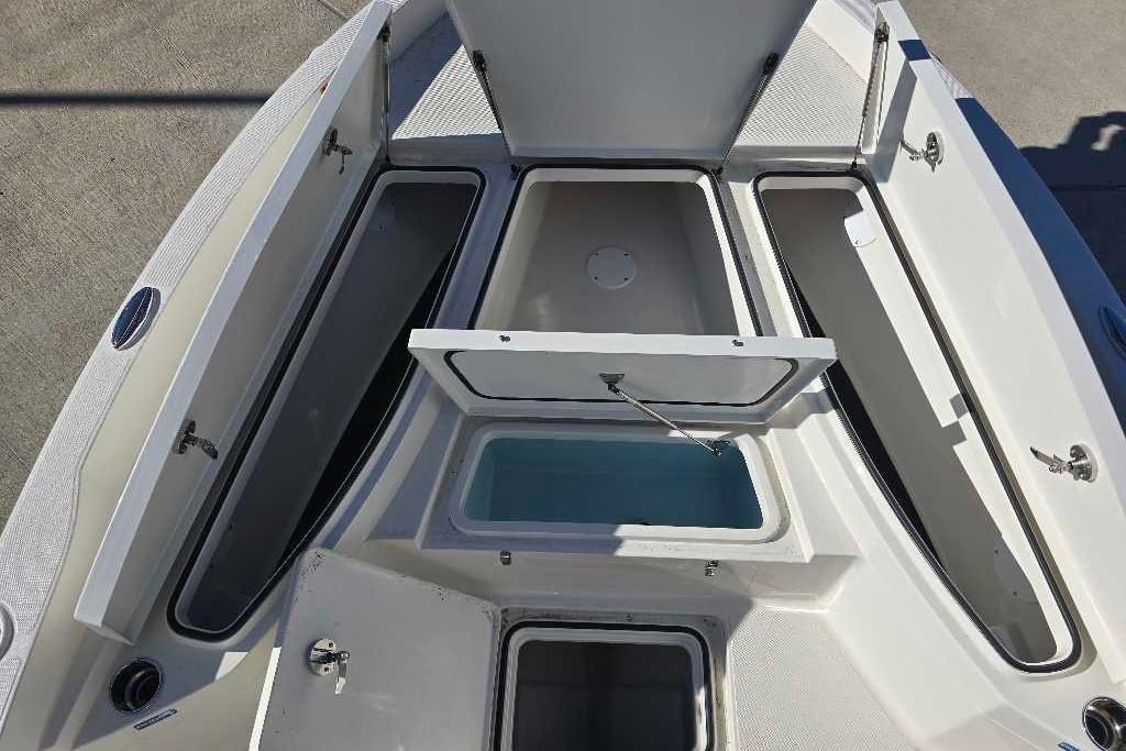 2025 Ranger 2510 Bay boat storage compartments open, showcasing spacious interior design.