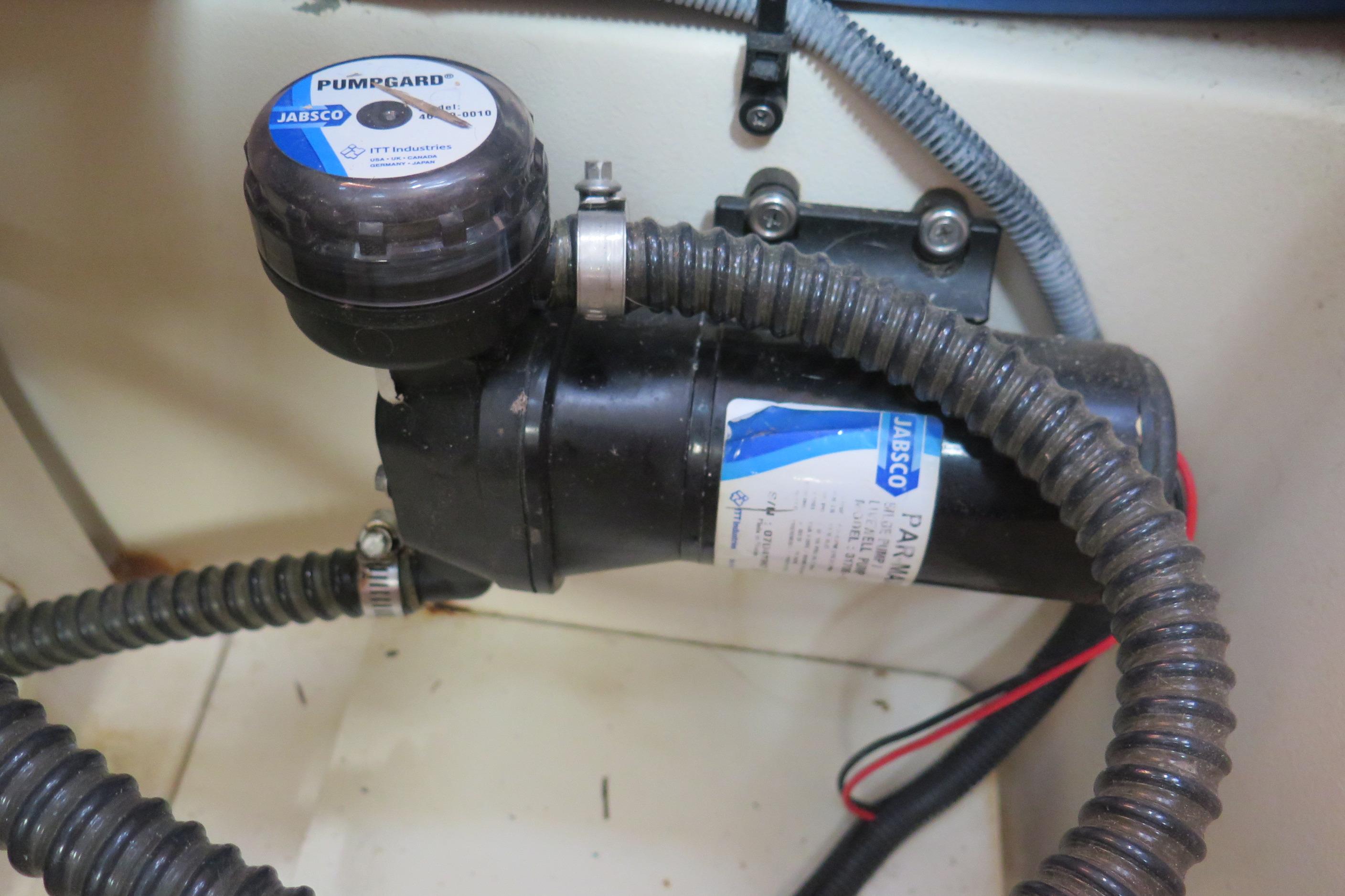 Jabsco pump in 2008 Hunter 41 Deck Salon, featuring Pumpgard filter and wiring.