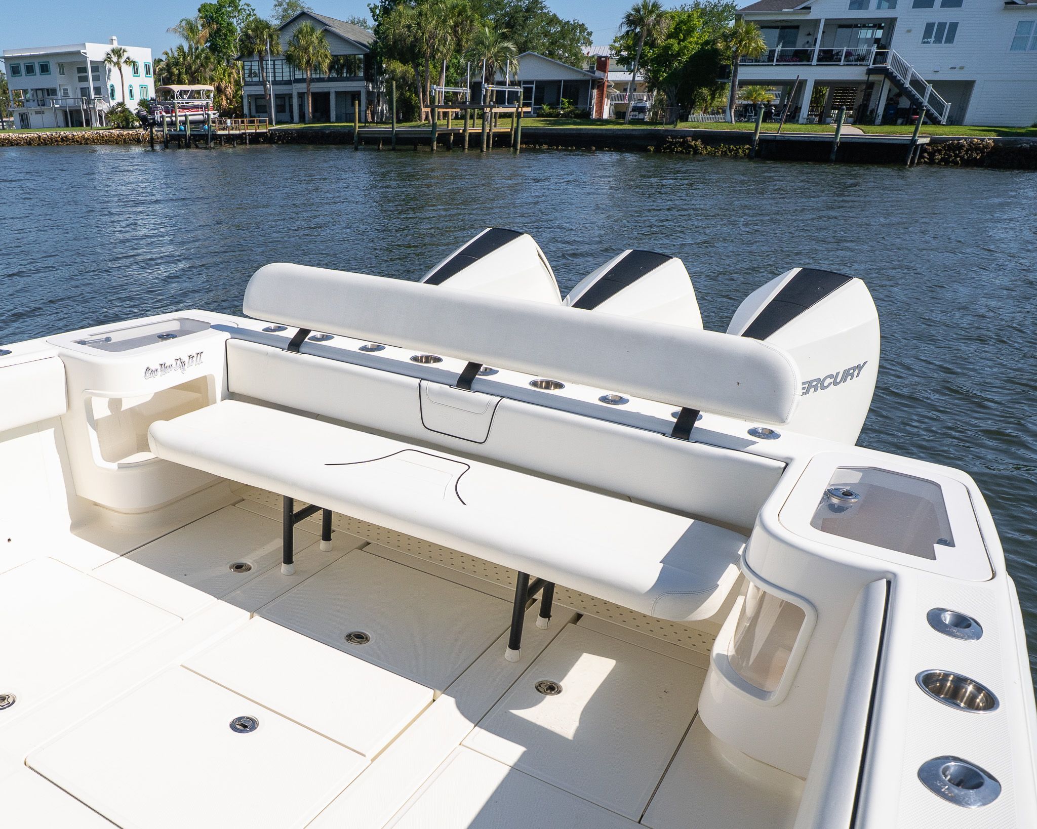 The image shows the stern of a 2022 SeaVee 370Z boat with three engines.