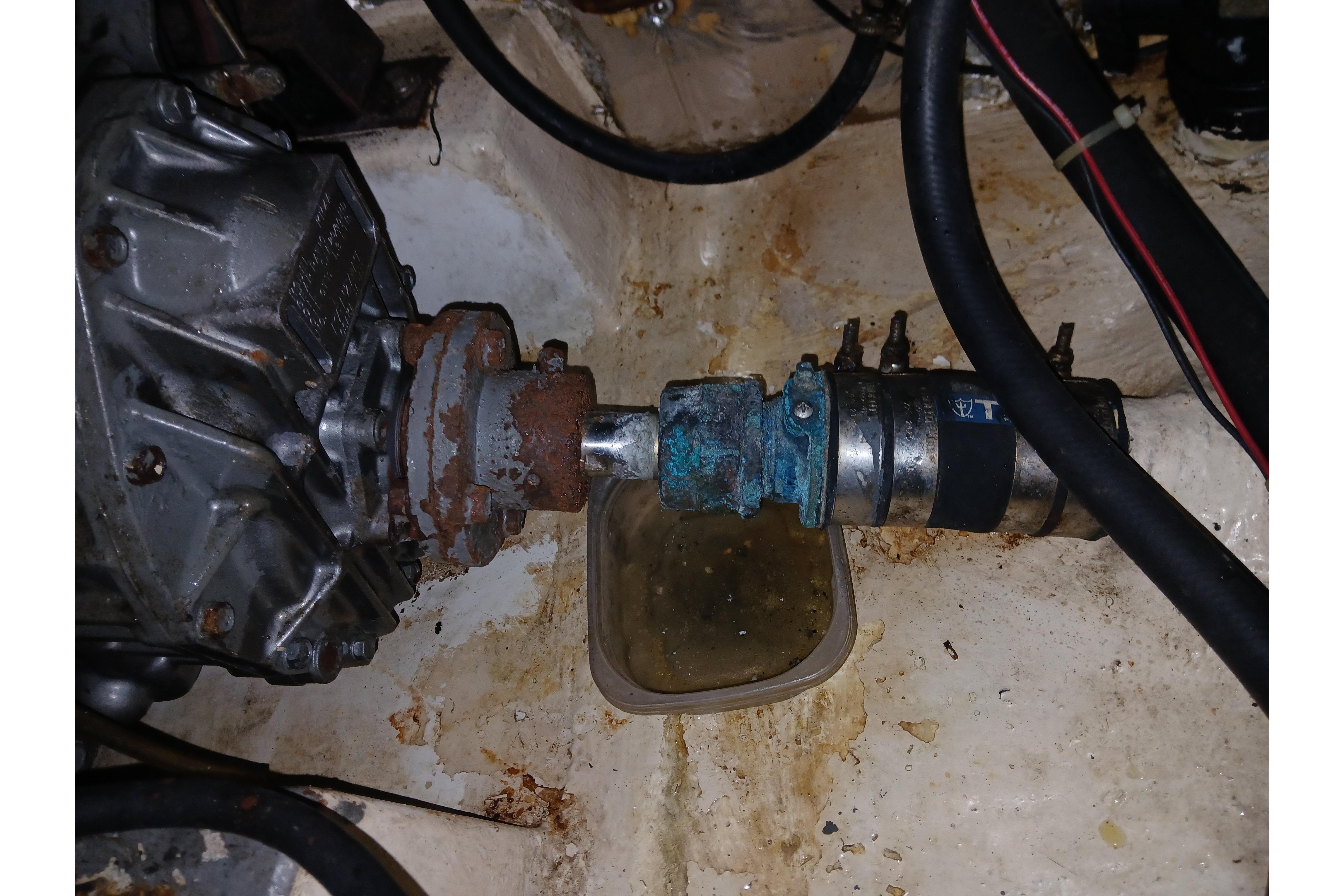 Engine compartment of a 1995 Catalina 42 MkII sailboat, showing mechanical components and hoses.