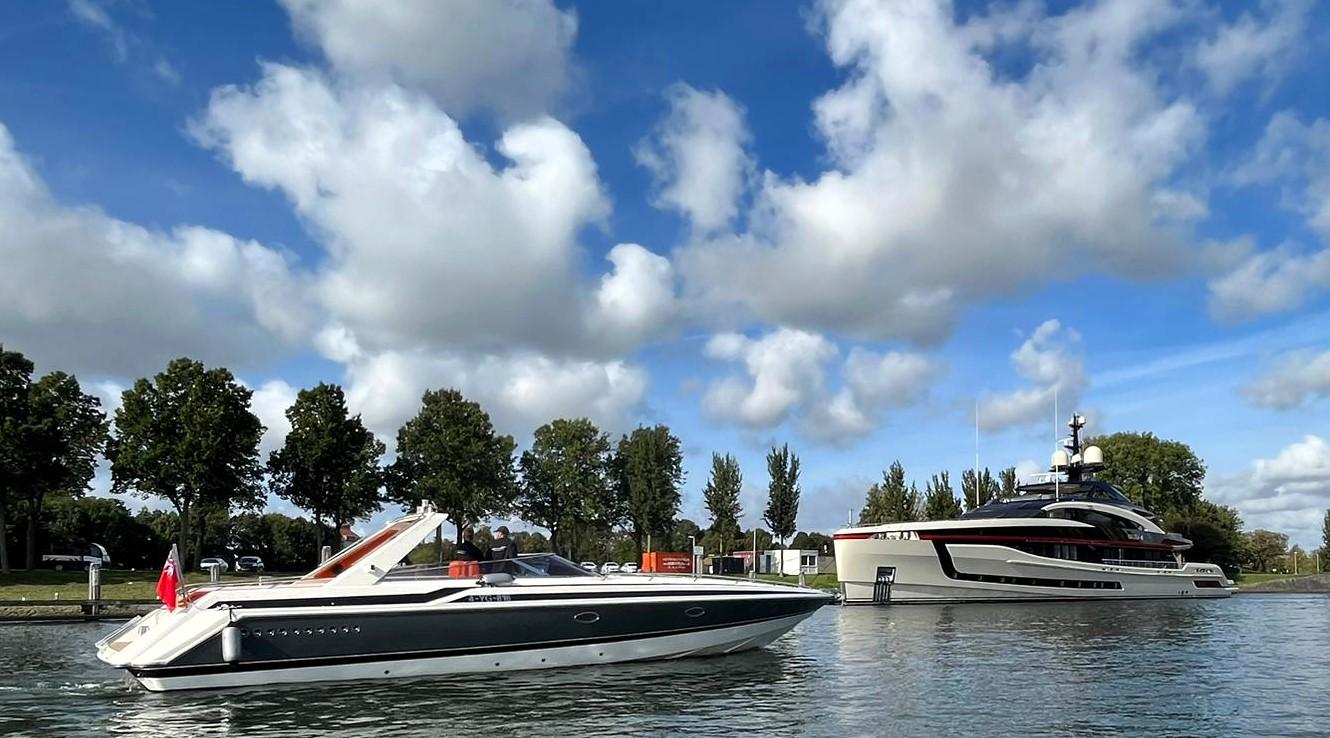 1991 Sunseeker Thunderhawk 43 yacht cruising on a sunny day with blue skies and clouds.