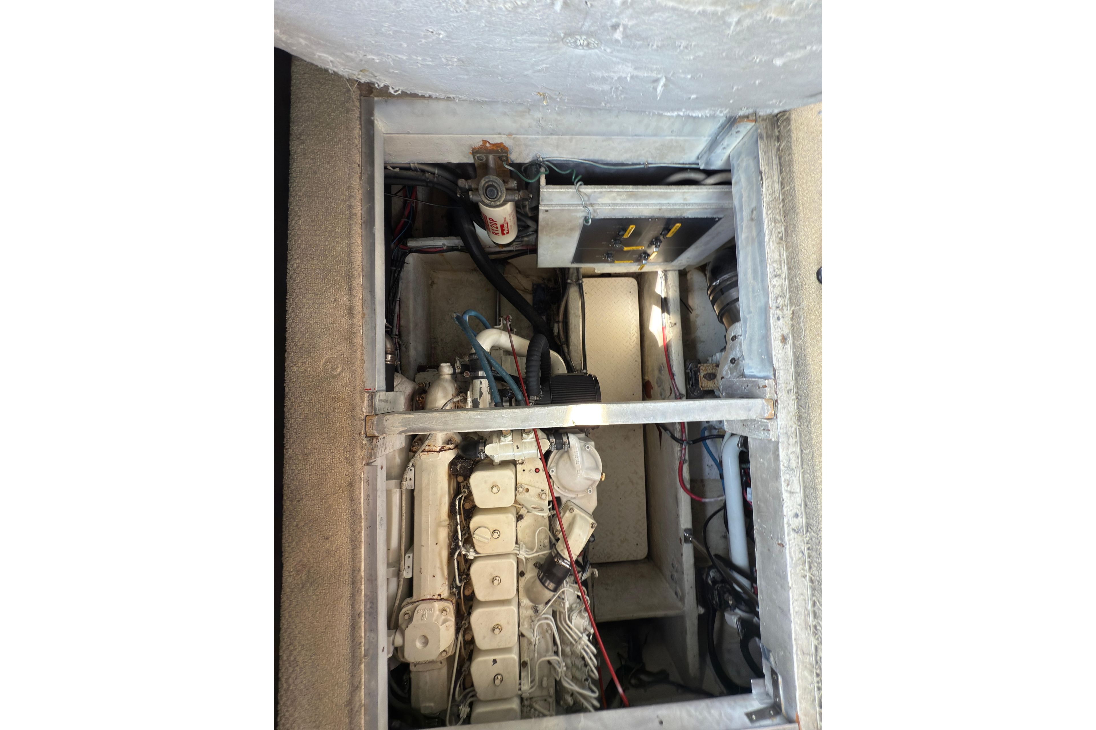 Engine compartment of 1997 Bayliner 3788 Command Bridge Motoryacht, showcasing mechanical components.