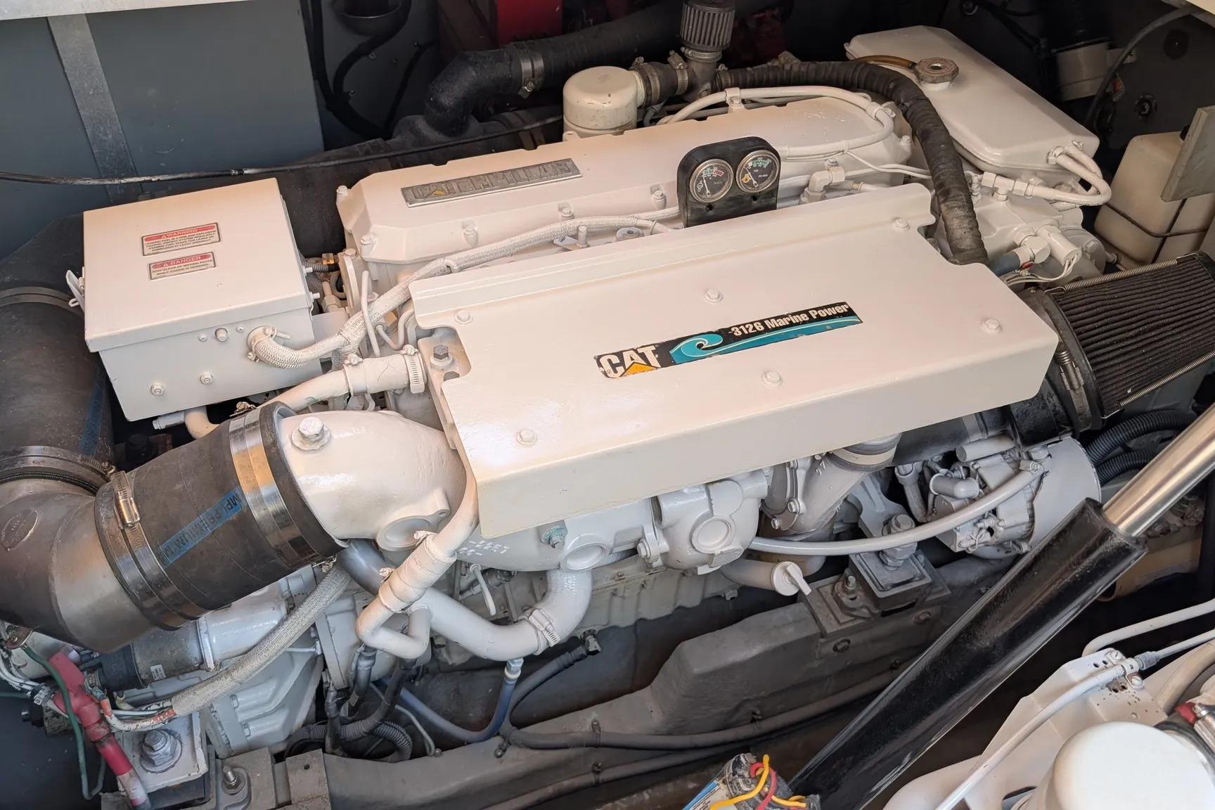 Engine of a 2000 Sea Ray 380 Sundancer, featuring a CAT 3126 Marine Power unit.