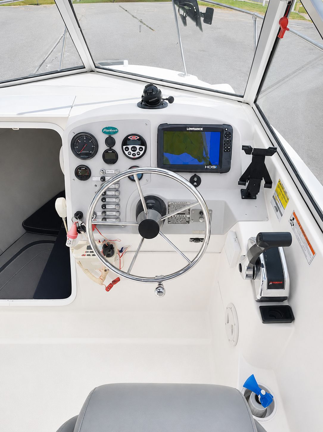 The cockpit of a 2007 Bayliner Trophy Pro 1902 with steering wheel, instruments, and navigation system.