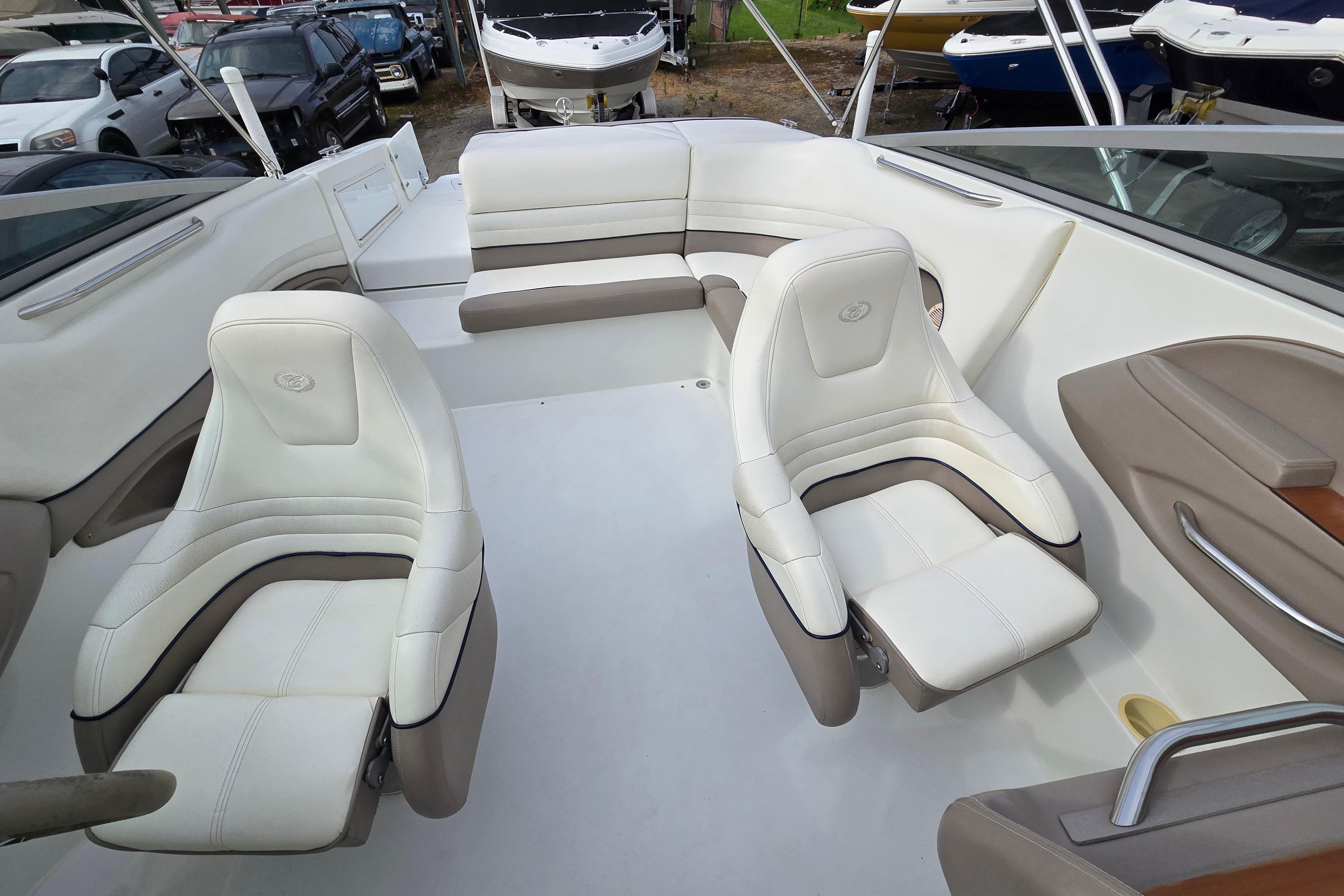 Interior of a 2000 Cobalt 246 boat with white and beige seating.