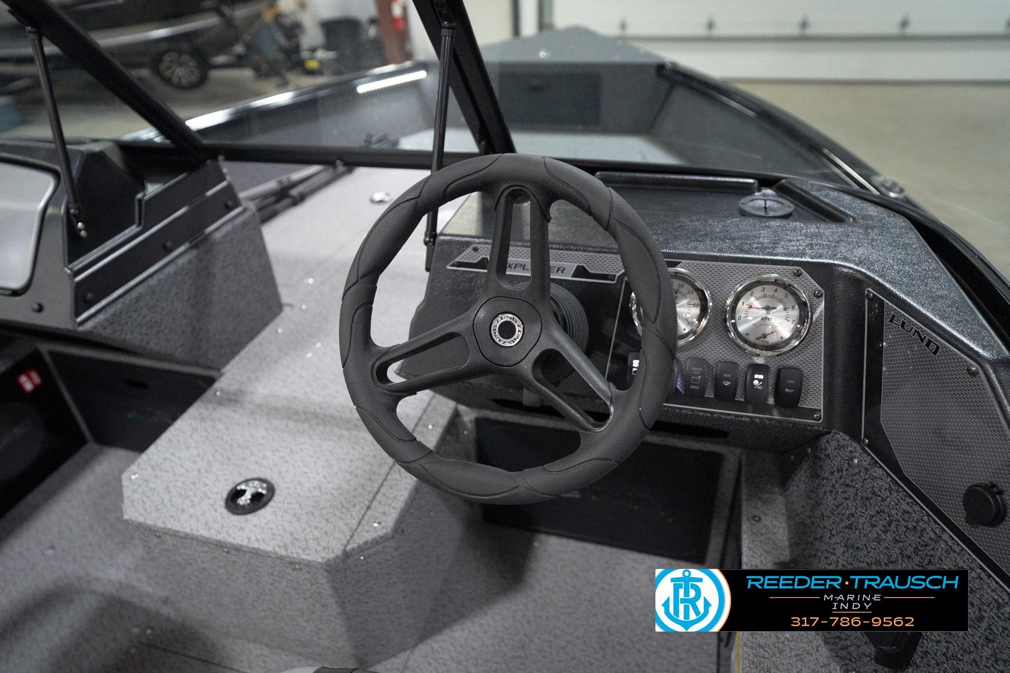 2026 Lund 1800 Explorer Sport boat interior with steering wheel and dashboard controls.
