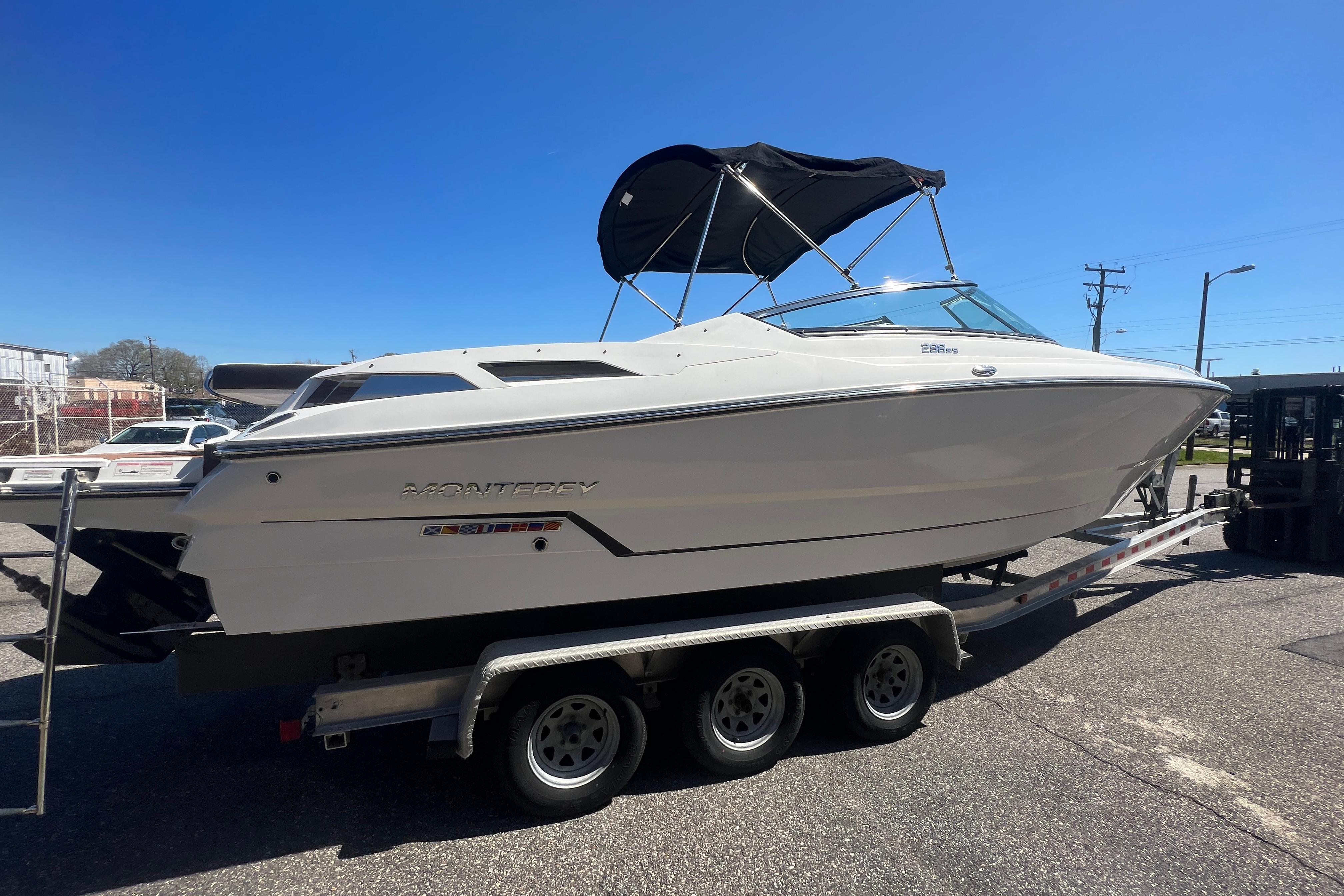 2017 Monterey 298SS Super Sport boat on trailer under clear blue sky.