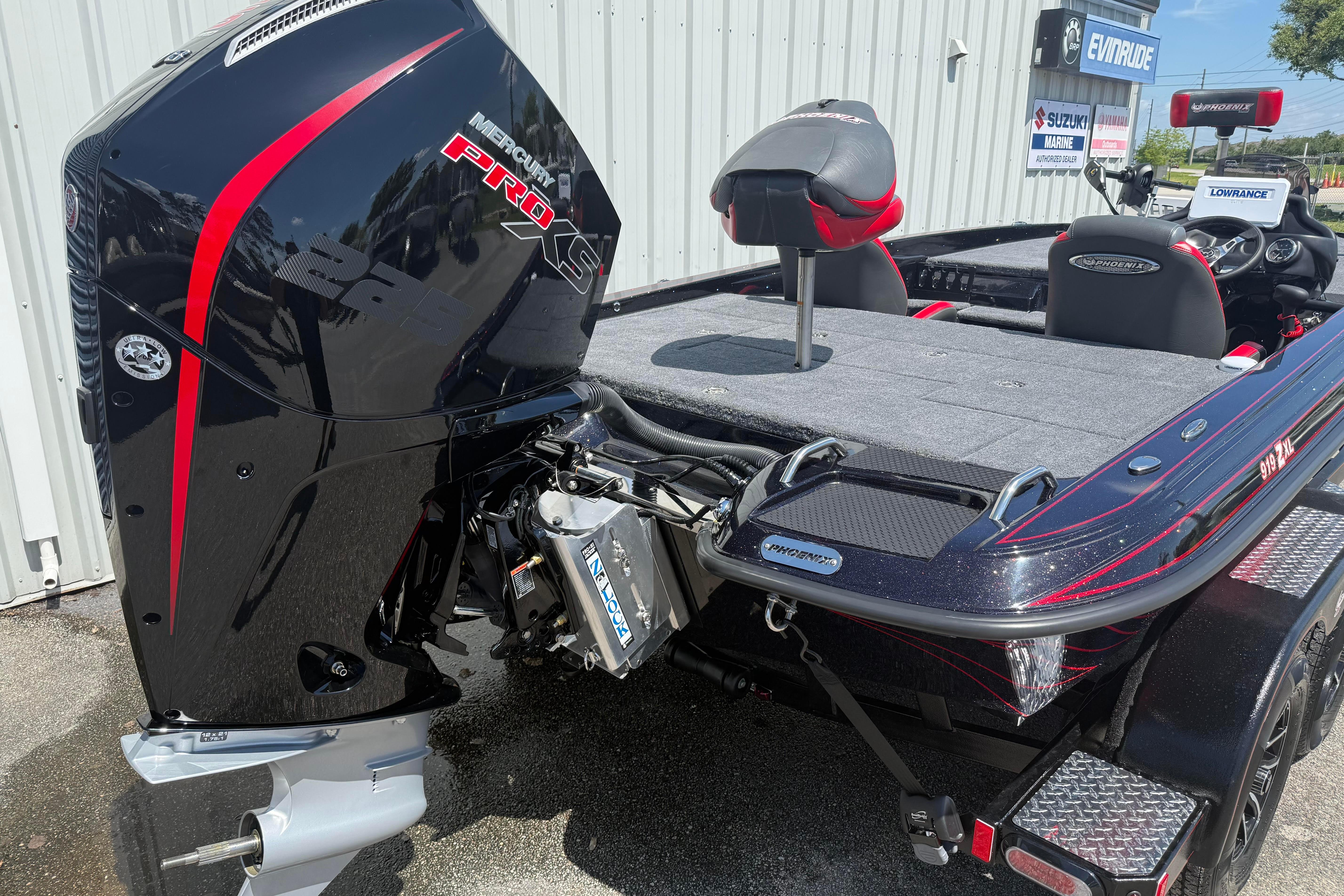 2027 Phoenix 919 ZXL boat with Mercury Pro XS engine, parked outdoors.