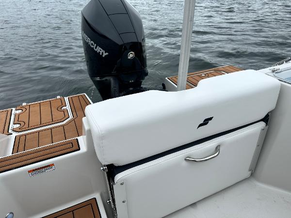2025 Starcraft SVX 211 OB CC boat with Mercury outboard motor on water.