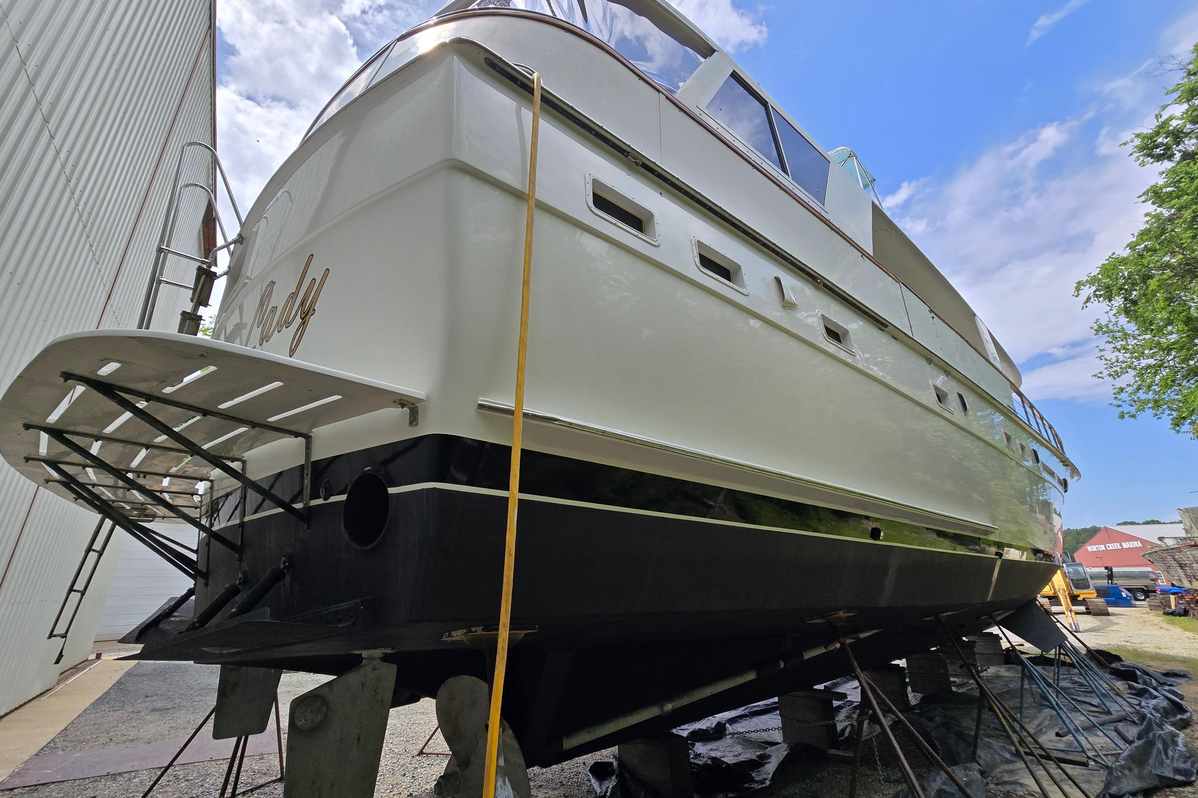 1980 Hatteras 70 Motor Yacht on dry dock, showcasing sleek design and sturdy construction.