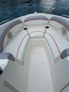 Interior of a 2008 Yamaha AR230 boat with white seating.