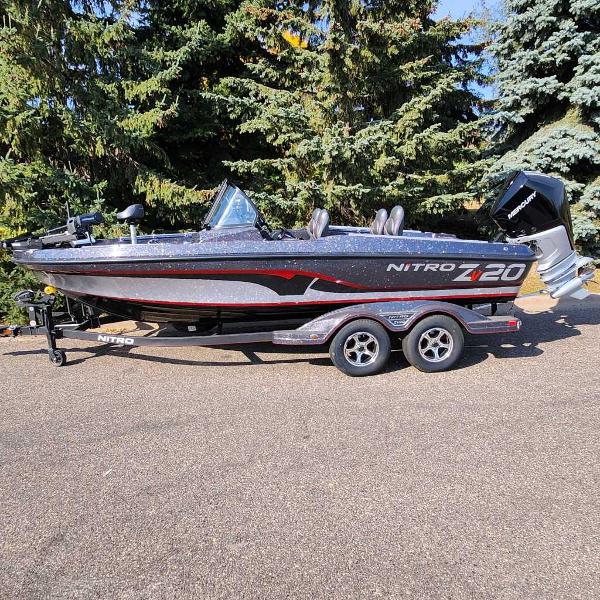 2024 Nitro ZV20 Pro fishing boat on trailer, parked outdoors.