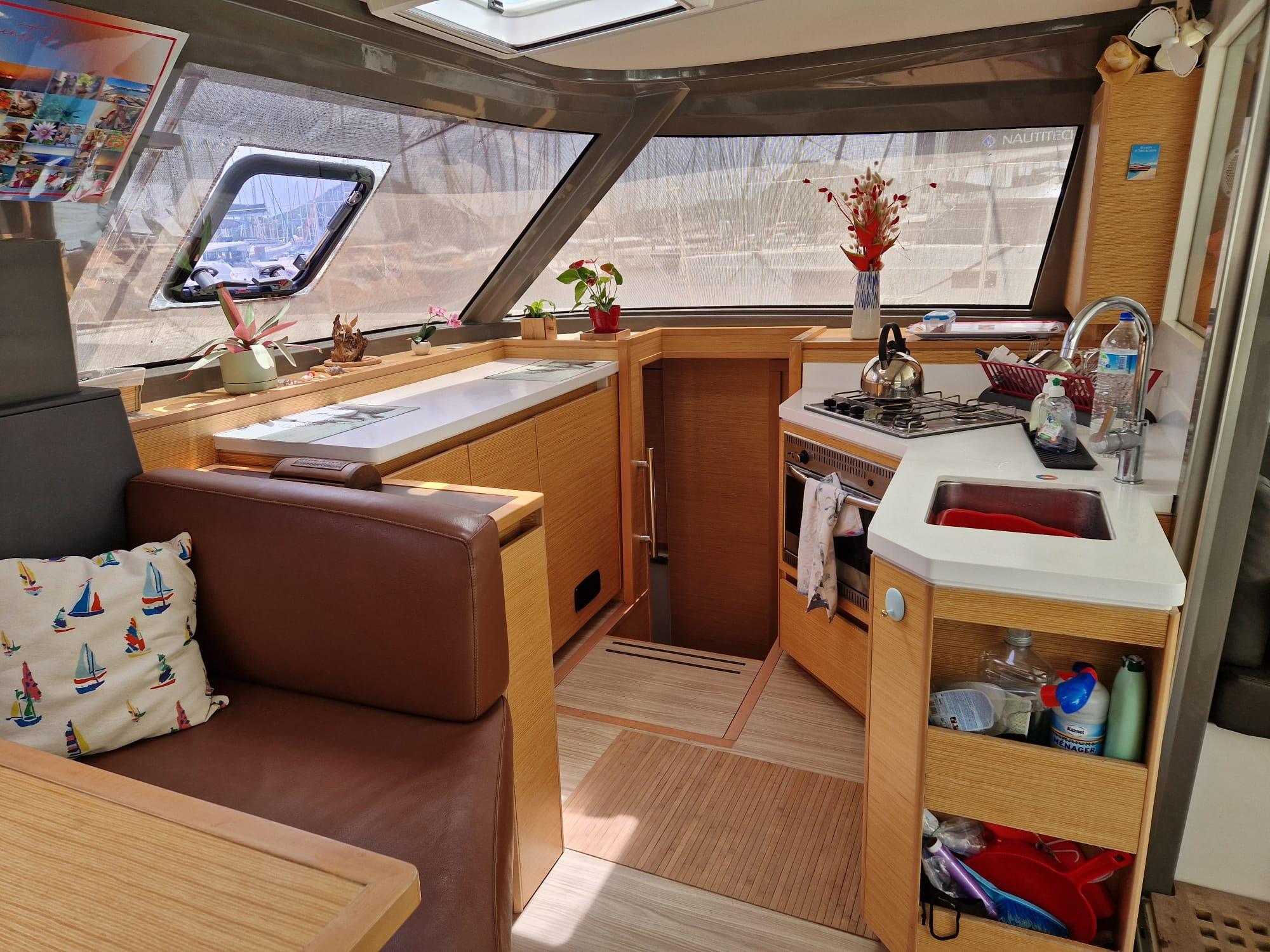 Interior of 2019 Nautitech 40 Open catamaran with modern kitchen and seating area.