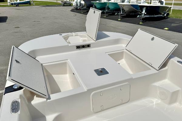 2025 Carolina Skiff 21 LS boat with open storage compartments on deck.