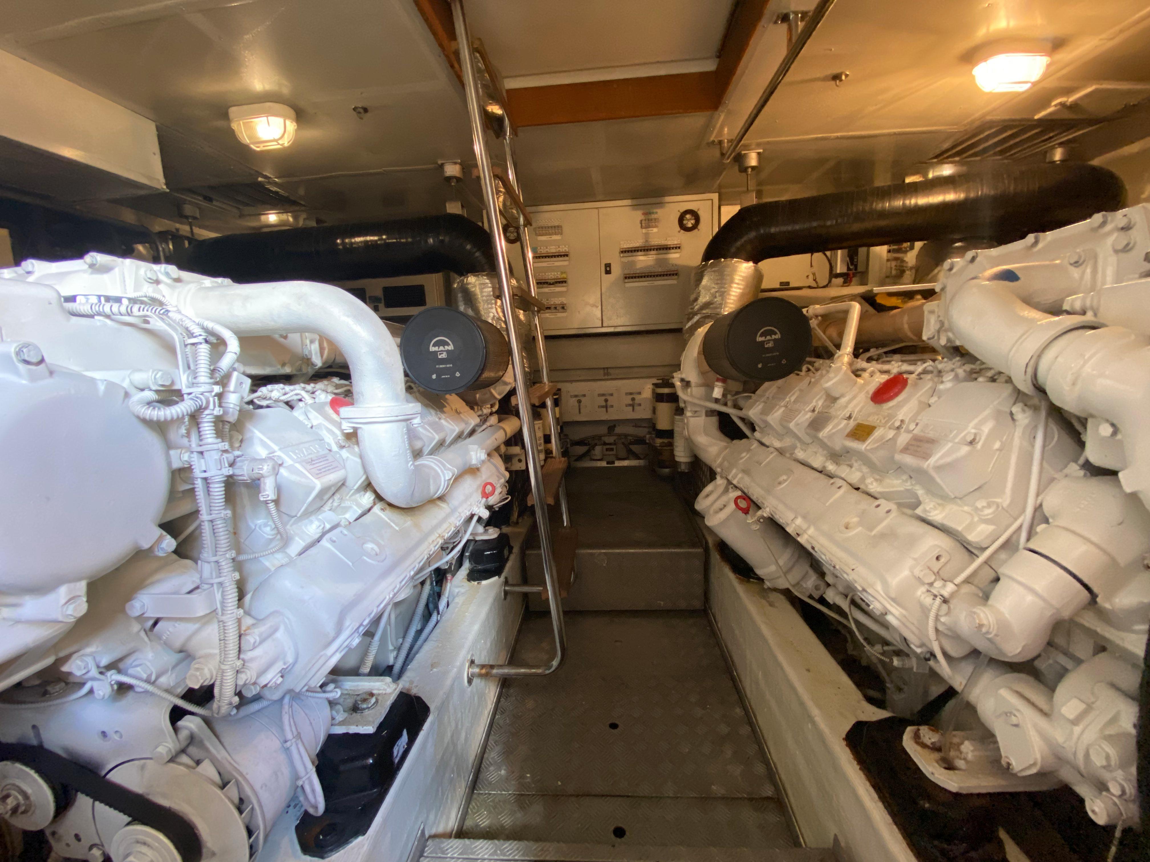 Engine room of a 2008 Dominator 680 with two large engines.