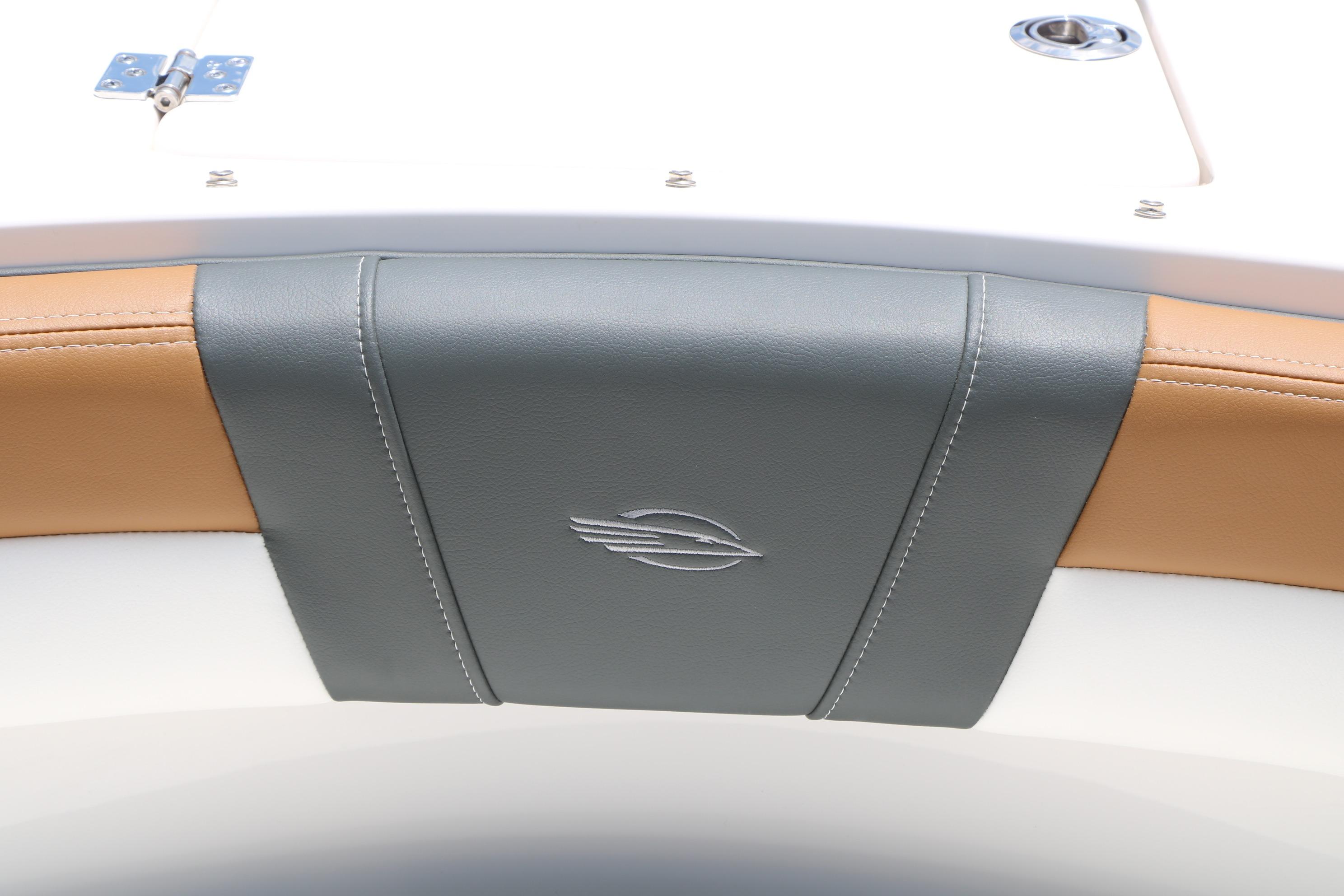 2025 Chaparral 23 SSi boat interior detail with gray and tan upholstery.