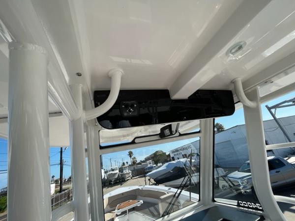 2023 Edgewater 340CC boat interior with overhead console and windows.