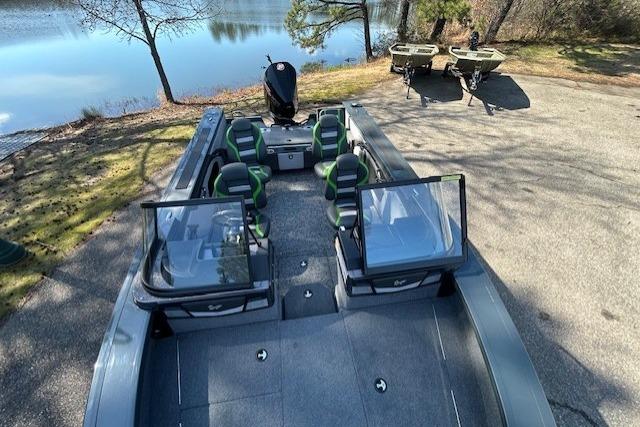 2025 Ranger VX1988 WT boat with seating, parked near a serene lake.