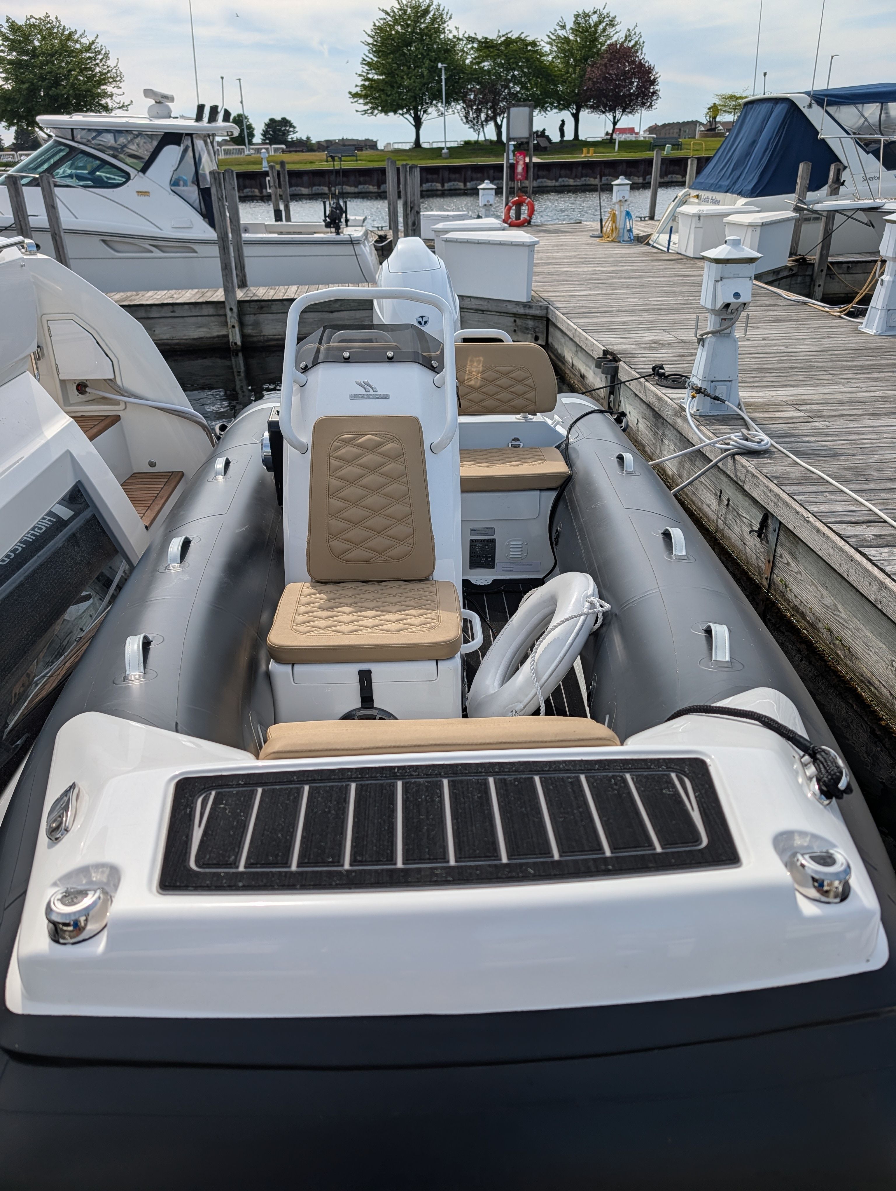 2024 Highfield Sport 390 boat docked at marina.