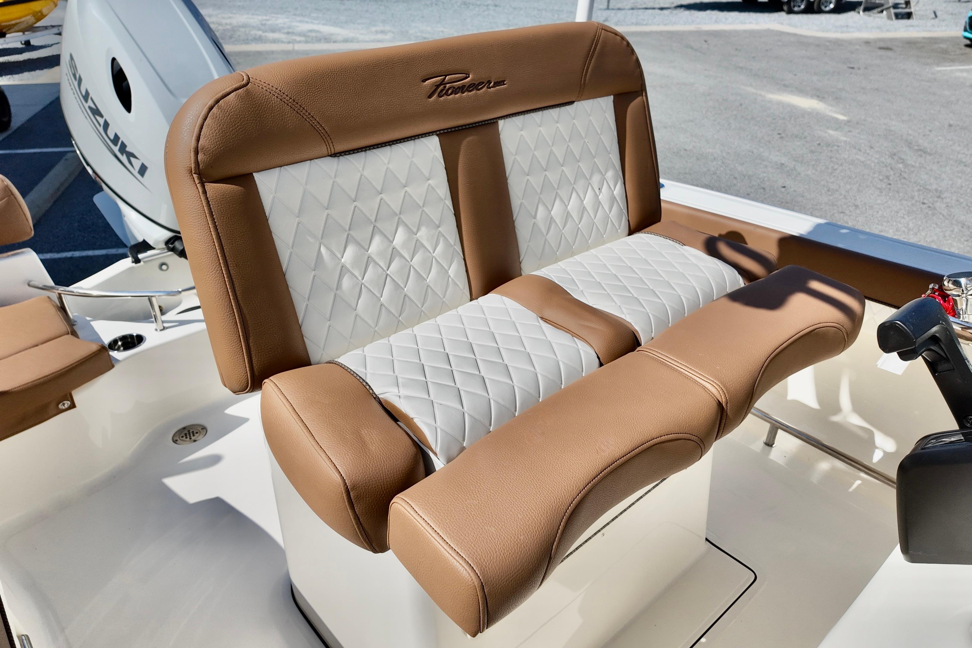 2026 Pioneer 202 Sportfish boat seat with tan and white diamond stitching.