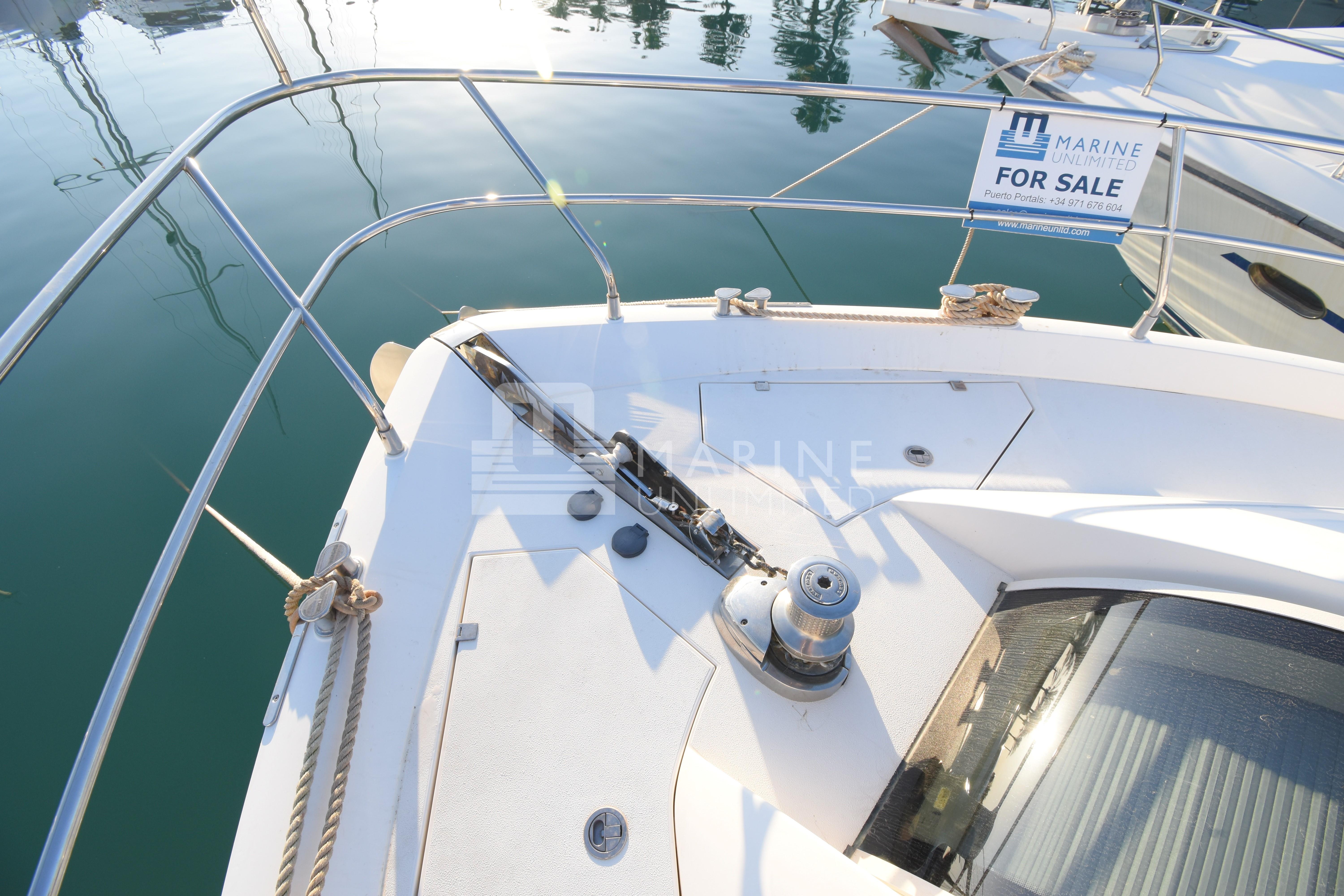 2010 Fairline Squadron 55 yacht deck with railing, for sale sign visible.