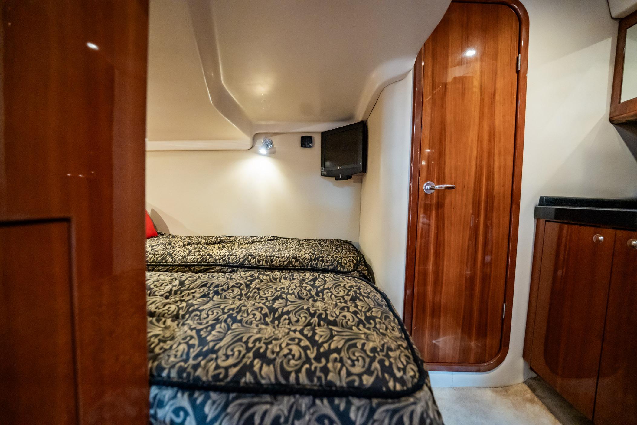 Luxurious cabin interior of 2008 Regal Commodore 4460 yacht with twin beds.