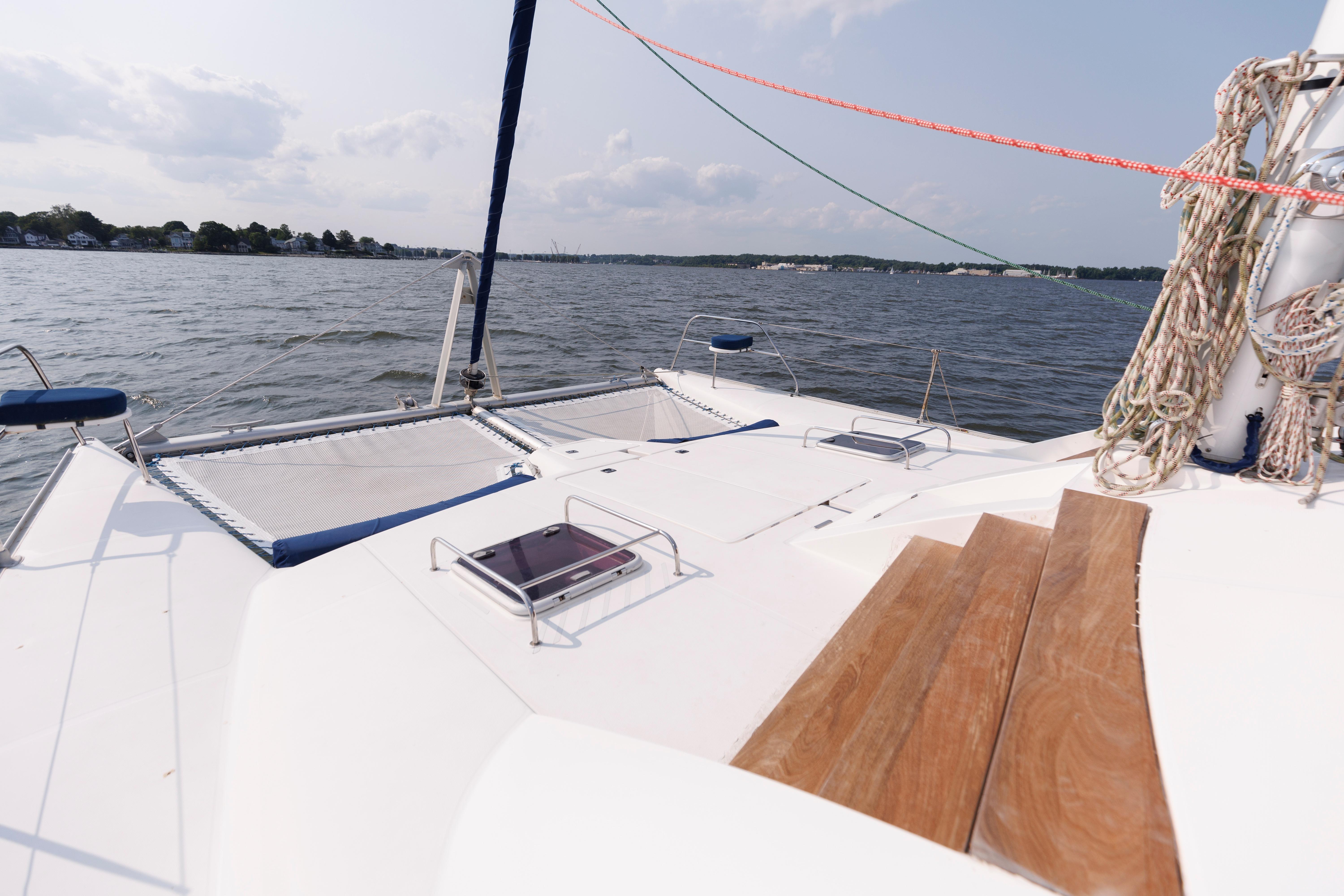 Catamaran deck view on water, Leopard 43 model, 2006, with ropes and seating.