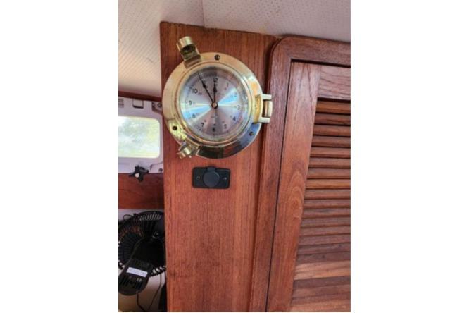 Brass barometer on 1985 Wasque Down East Cruiser wooden interior.