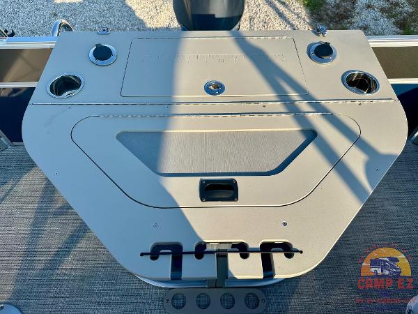 2025 South Bay 224FCR LE boat console with cup holders and storage compartments.