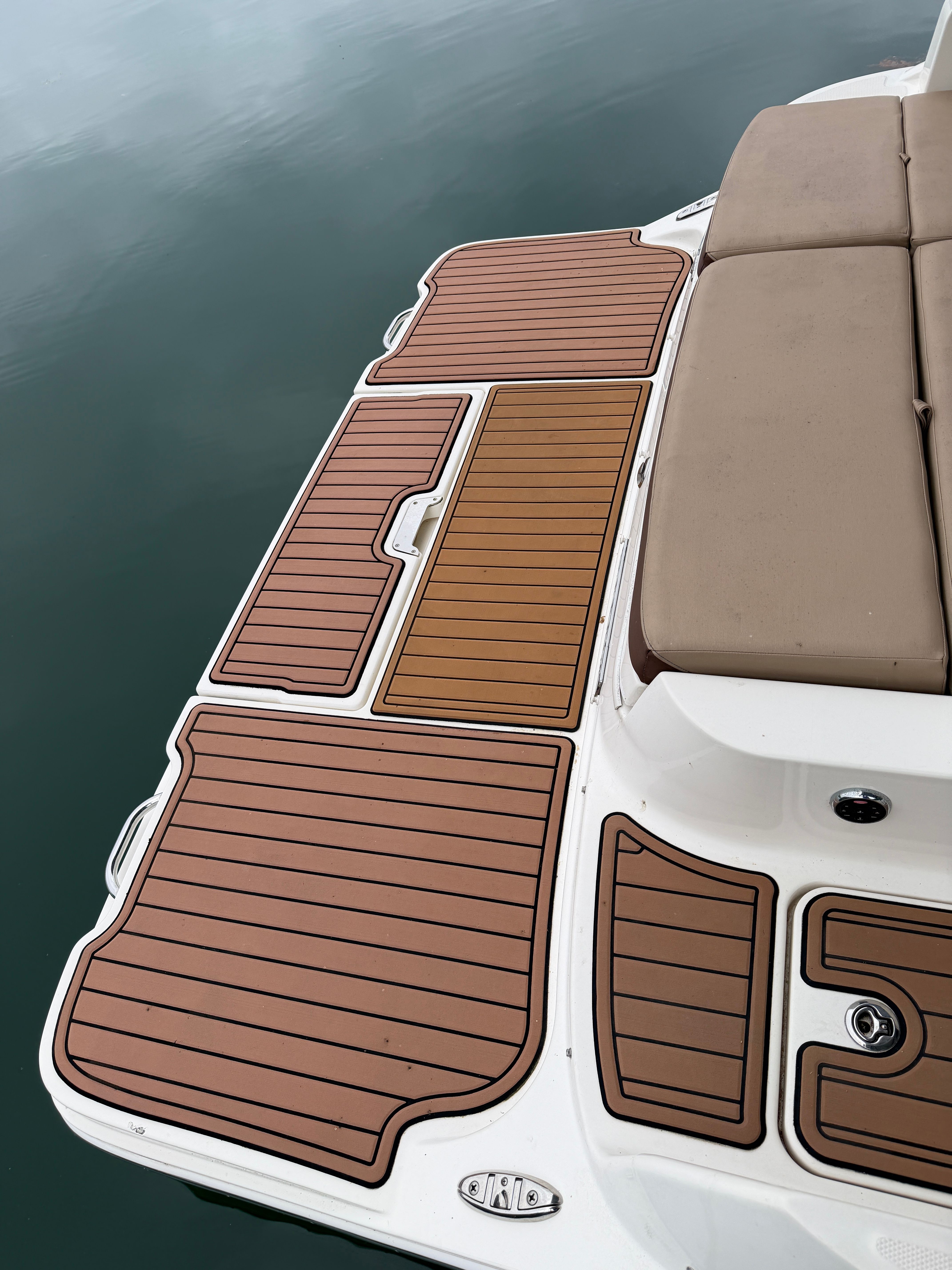 2016 Sea Ray 290 Sundeck with teak deck and cushioned seat.