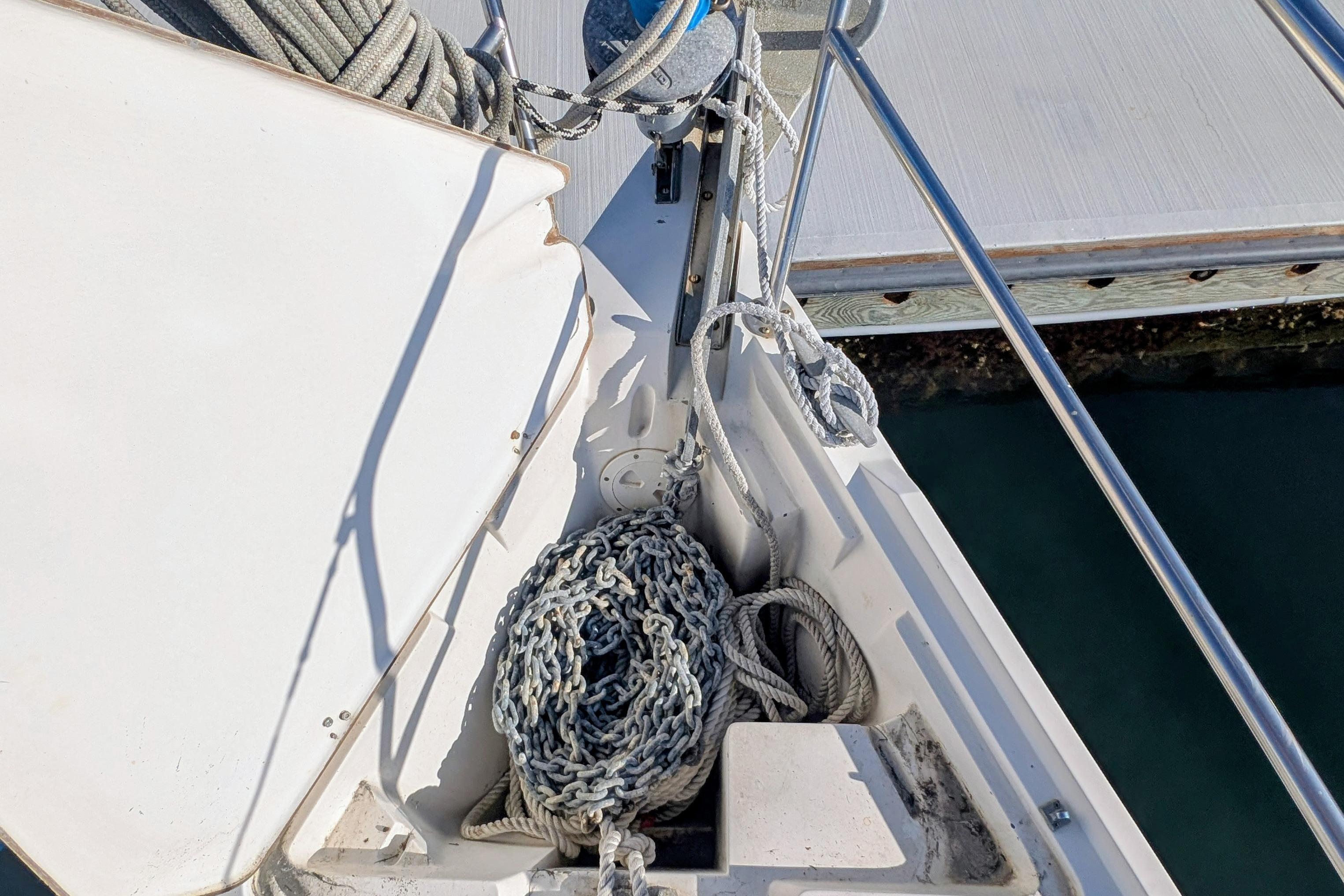 Anchor chain and ropes on a 1989 Catalina 34 sailboat deck.