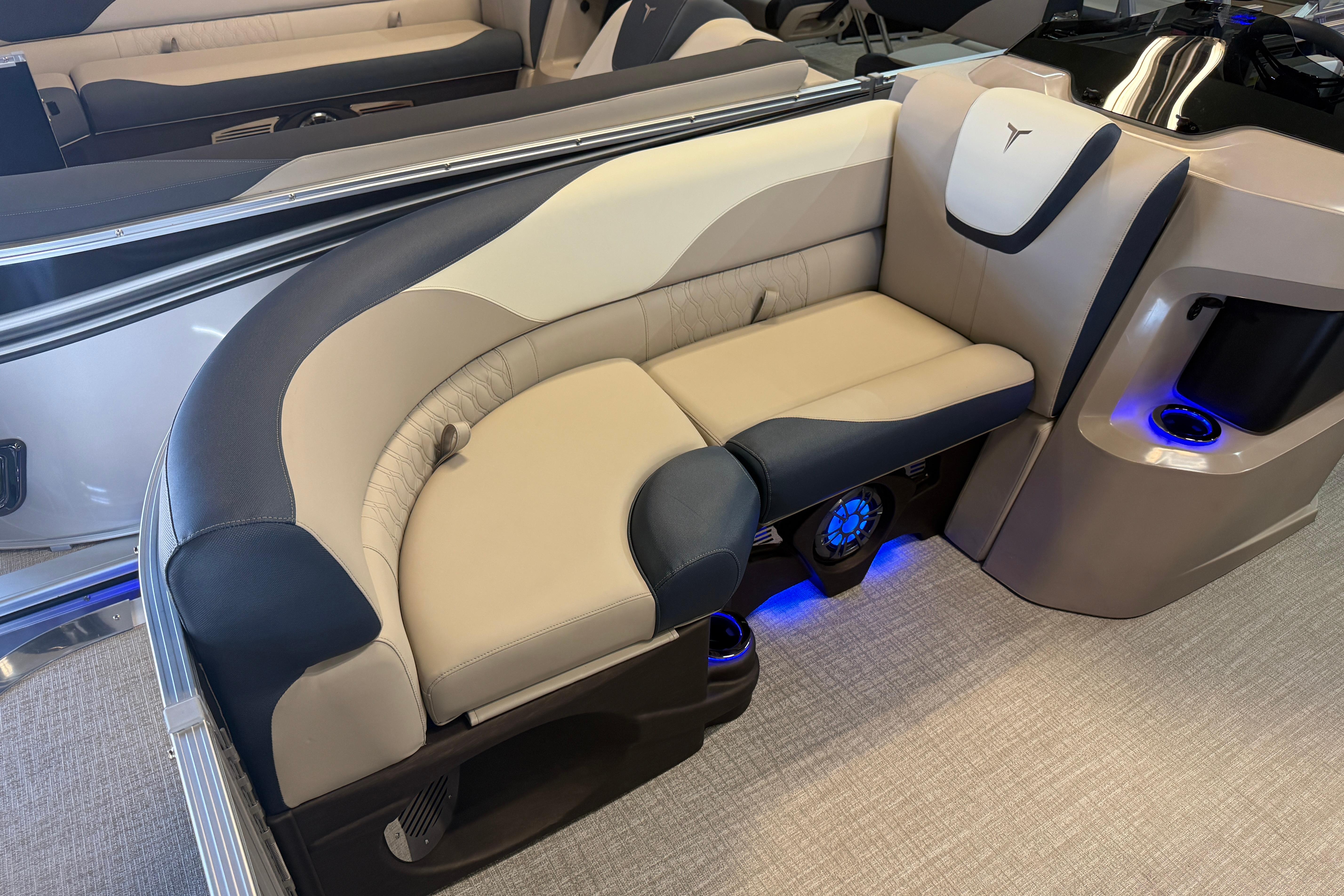 Luxurious seating on 2026 Tahoe Pontoon LTZ Quad Lounger Shift with ambient lighting.