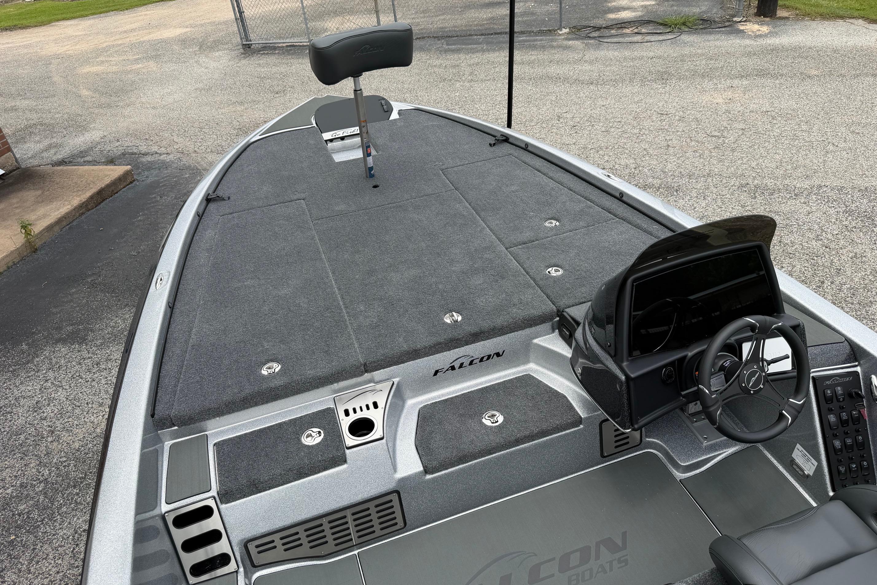 Interior view of 2027 Falcon F20 PREDATOR boat, featuring steering console and seating.