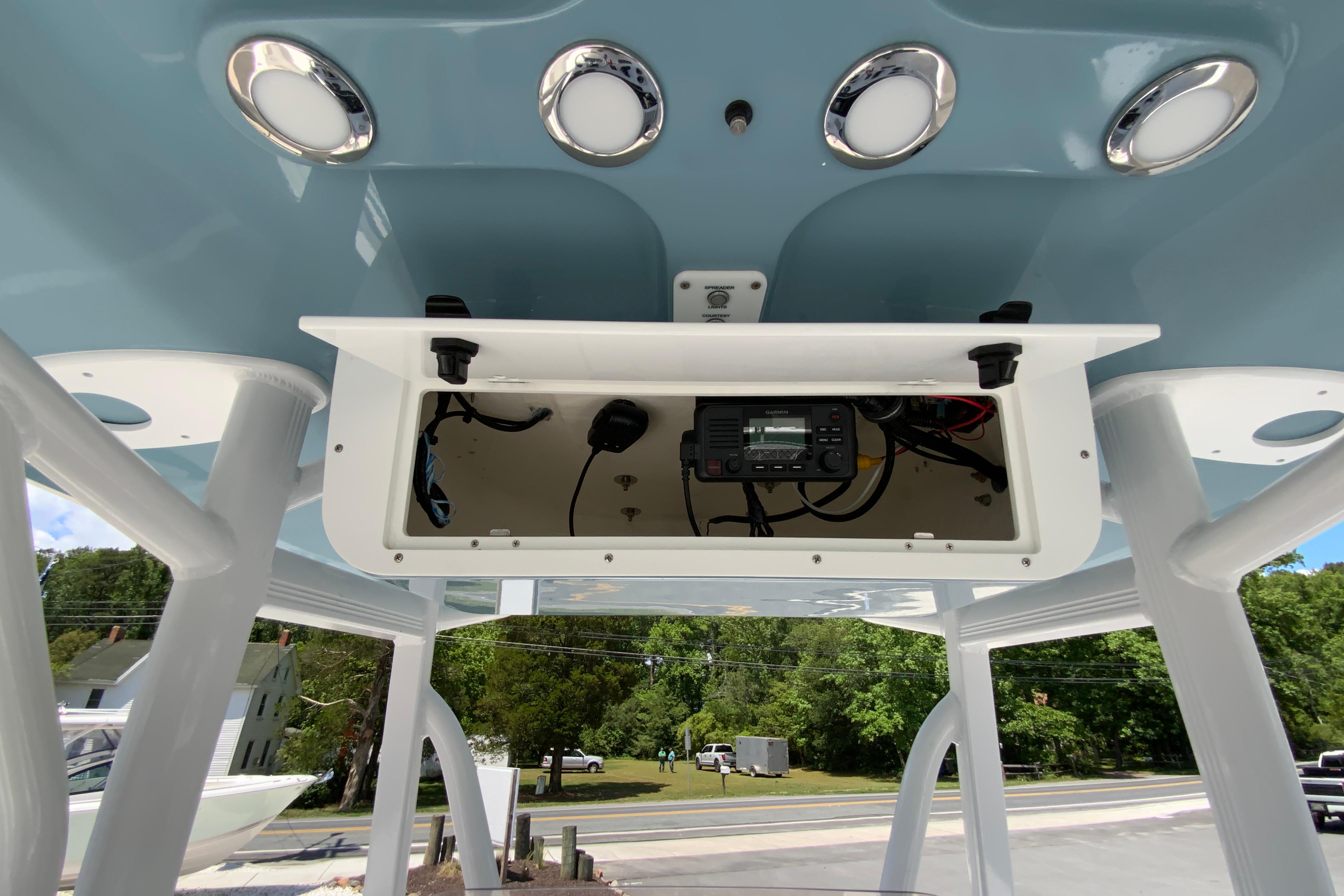 2024 Sea Hunt Ultra 234 boat console with electronic equipment and overhead lighting.