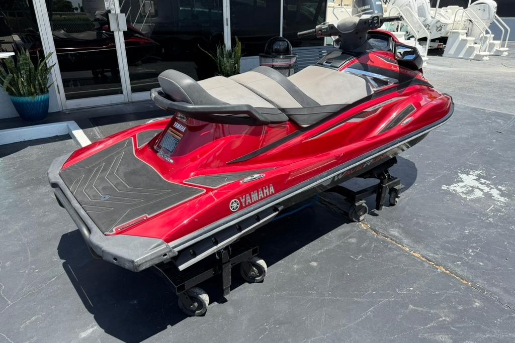 2019 Yamaha VX Limited jet ski in vibrant red, parked on a concrete surface.