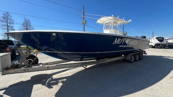 2005 Contender 36 Open boat on a trailer in a parking lot.